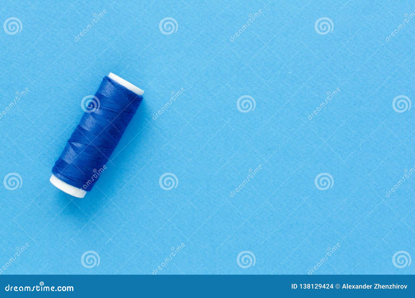 Spool of Thread on Paper Background Stock Photo - Image of colorful