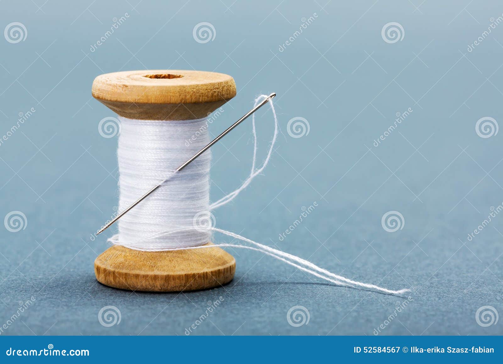 Spool of White Sewing Thread and Needle Stock Image Image of roll