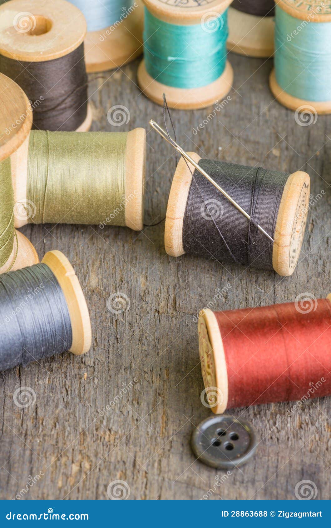 Spools of Sewing Thread with Needle Stock Photo Image of fiber, craft