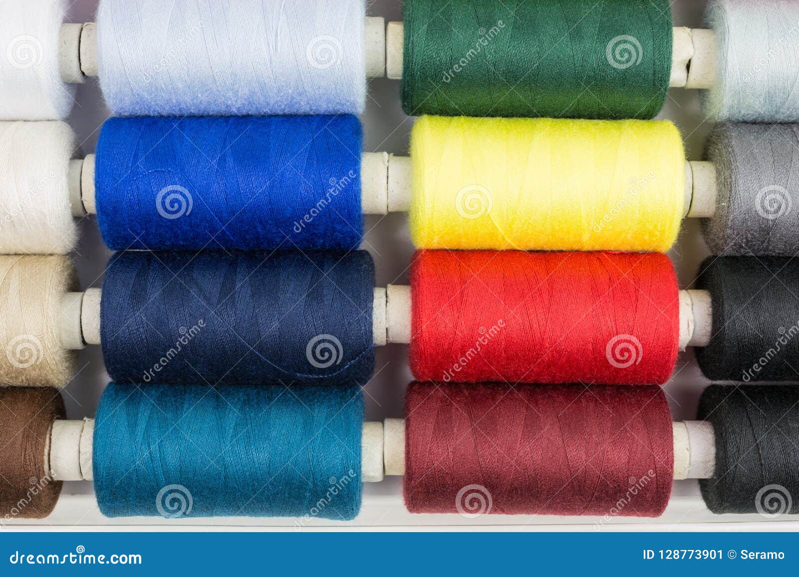 Spools of sewing threads stock image. Image of threads 128773901