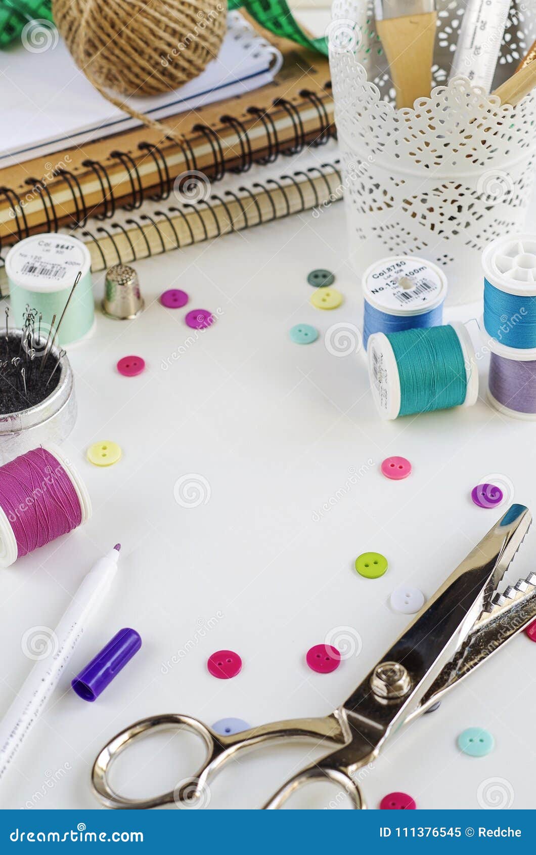 Spools of Thread and Basic Sewing Tools Including Pins, Needle, a