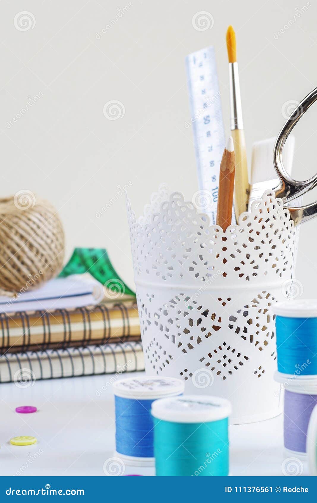 Spools of Thread and Basic Sewing Tools Including Pins, Needle, a