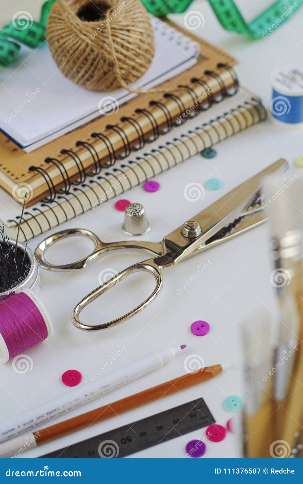 Spools of Thread and Basic Sewing Tools Including Pins, Needle, a