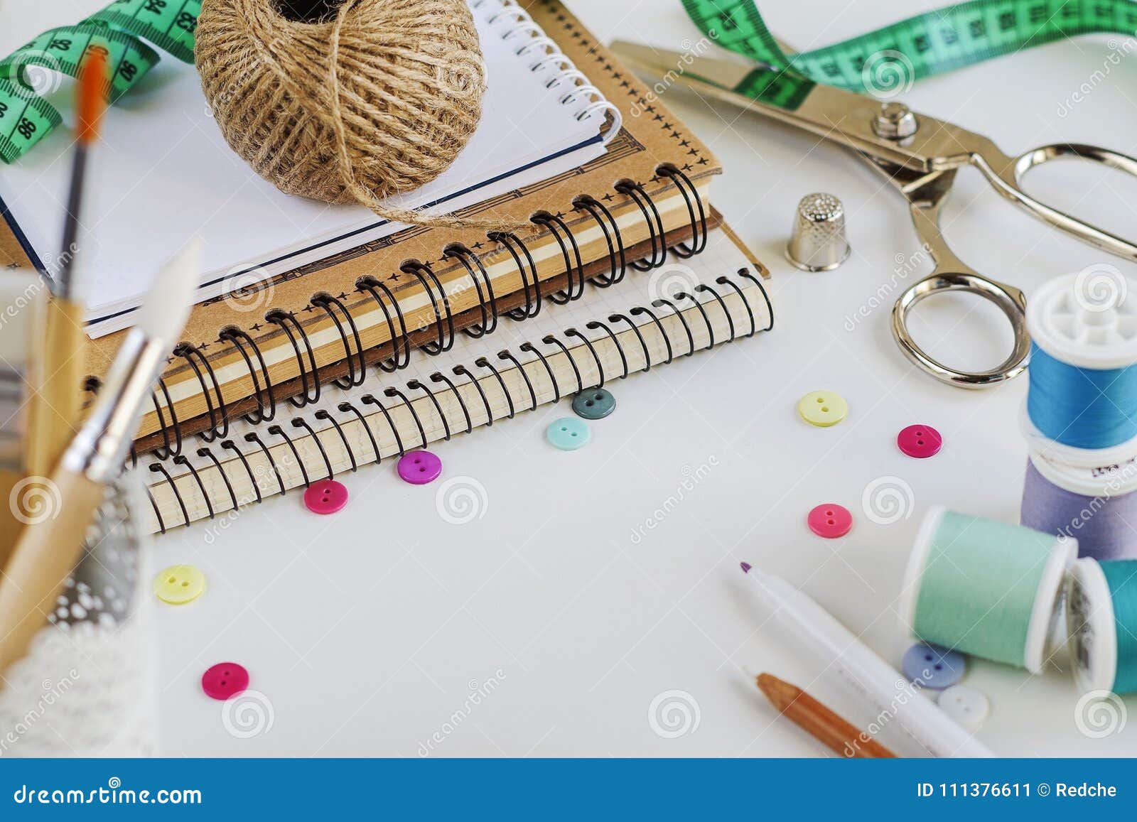 Spools of Thread and Basic Sewing Tools Including Pins, Needle, a