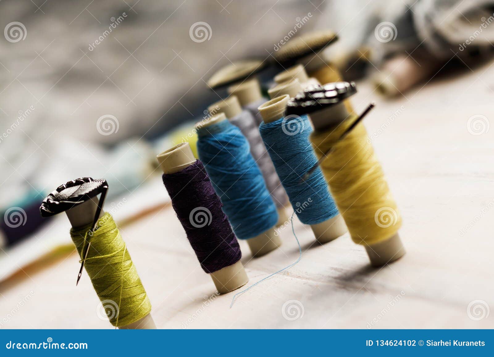 . Spools of Thread and Buttons and Needles in Them. the Concept of ...