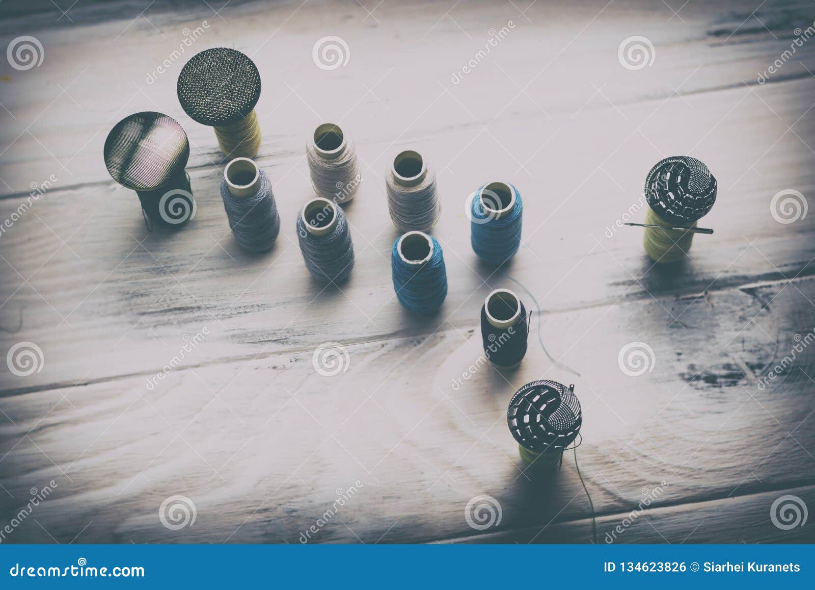 . Spools of Thread and Buttons and Needles in Them. the Concept of ...