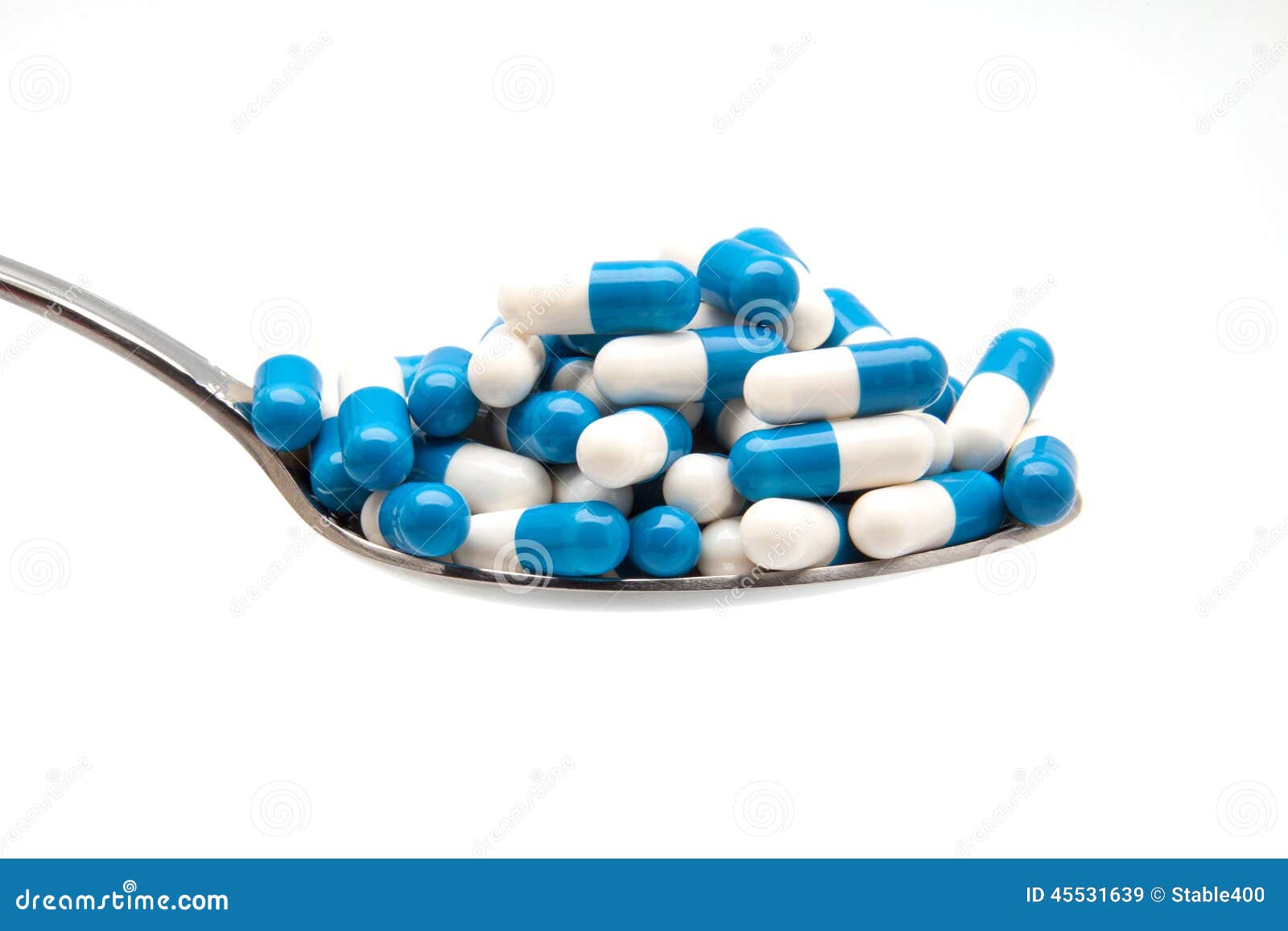 spoon and capsulas medicas