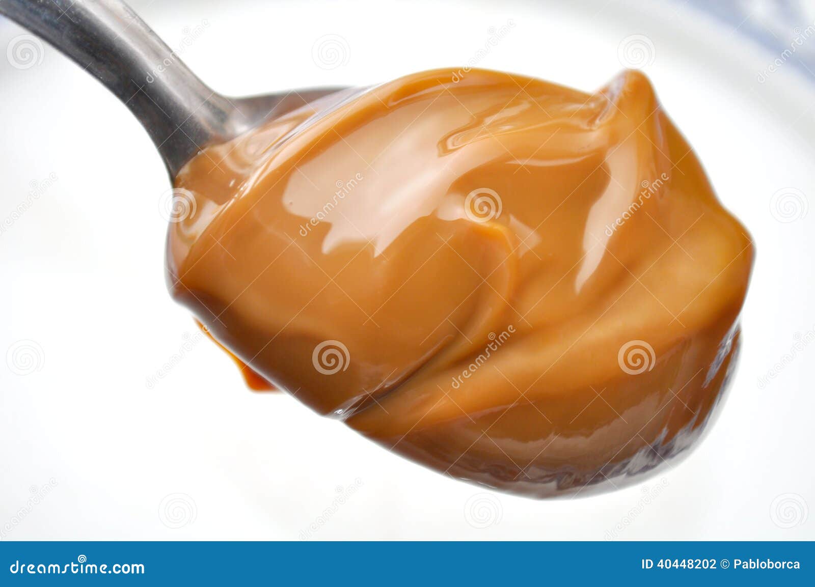 spoon with dulce de leche