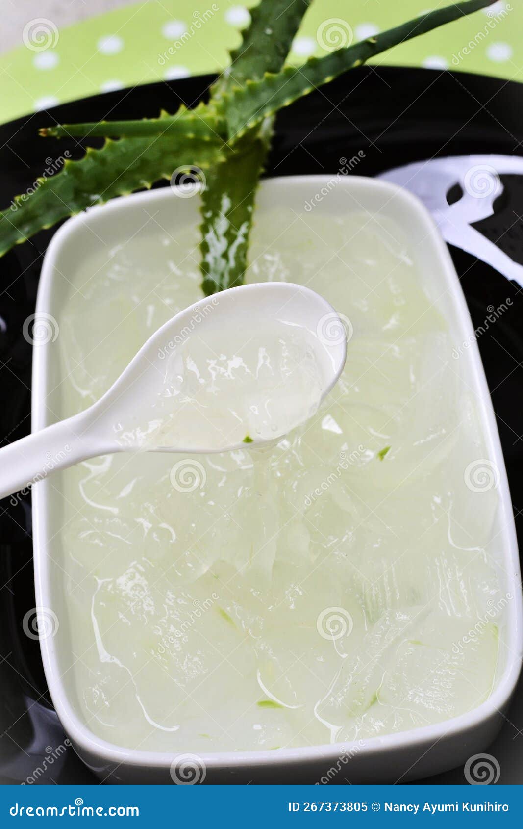 on the spoon the goo of aloe vera