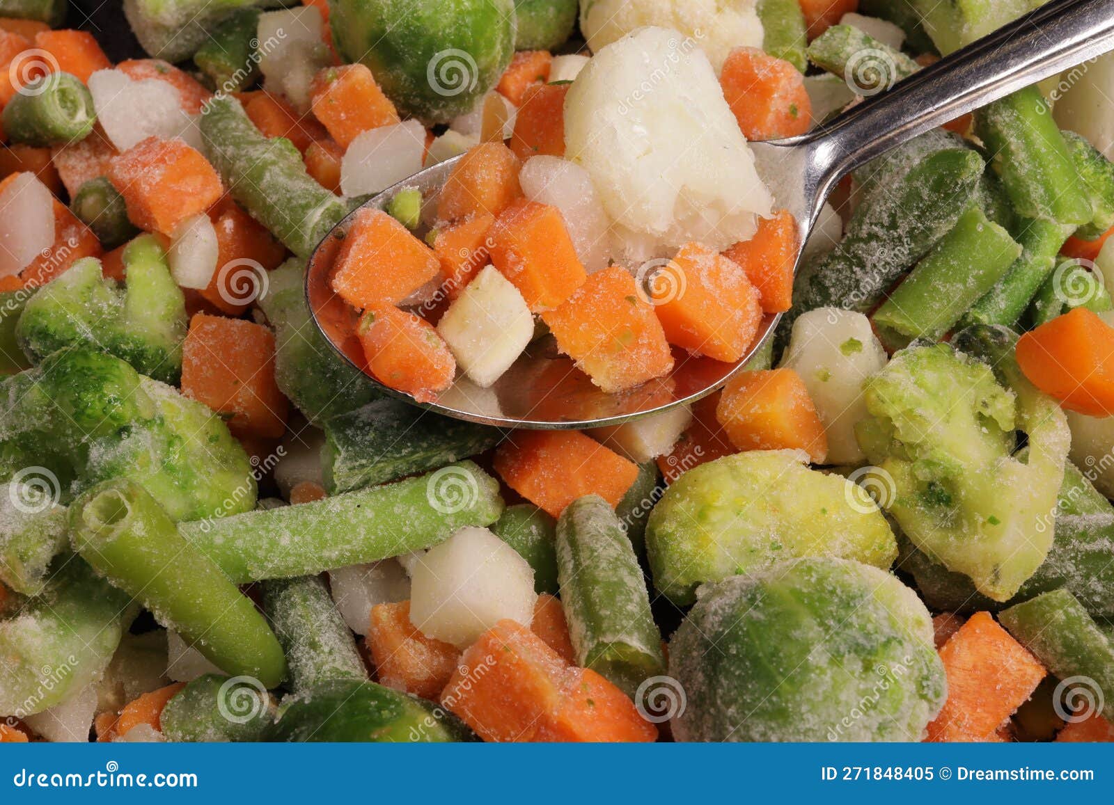 Spoon Picks Up Fresh Frozen Vegetables on White Background Stock Image Image of vitamin, vegan