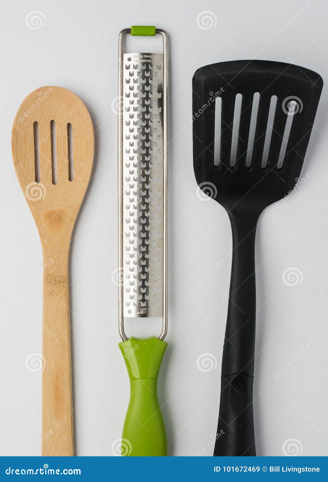 spoon spatula zester on white background cropped top view