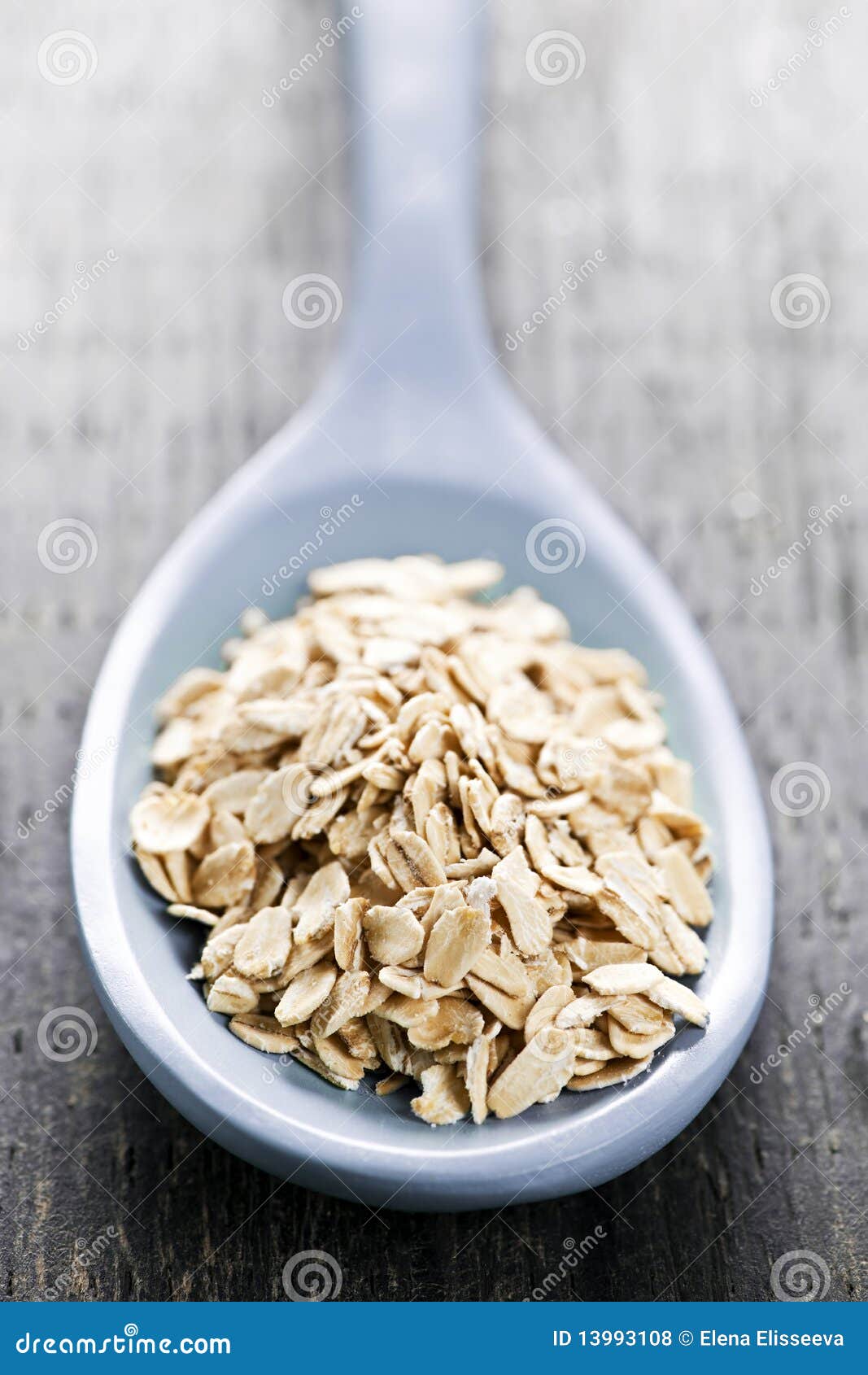 Spoon of Uncooked Rolled Oats Stock Photo - Image of health ...