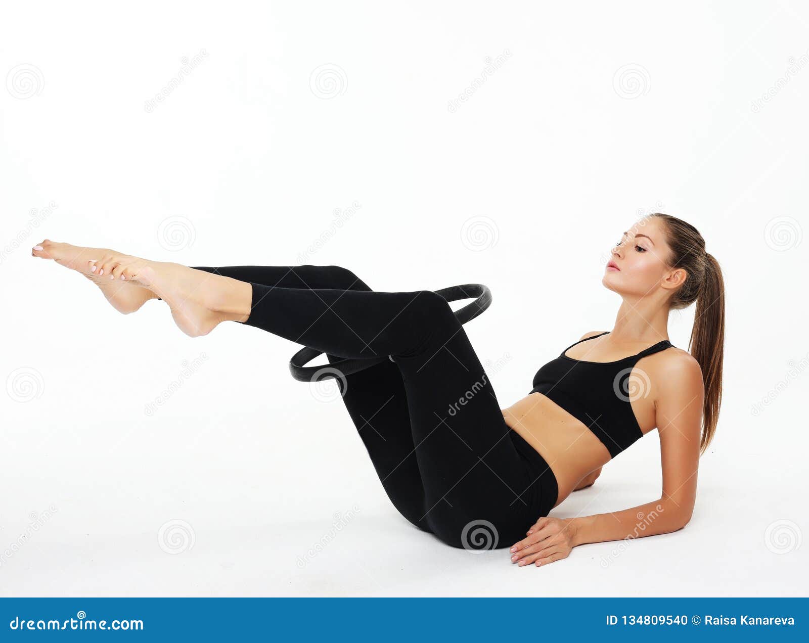 Young sporty woman with perfect body having a training with pilates ring  over white background Stock Photo by ©kanareva 232679156