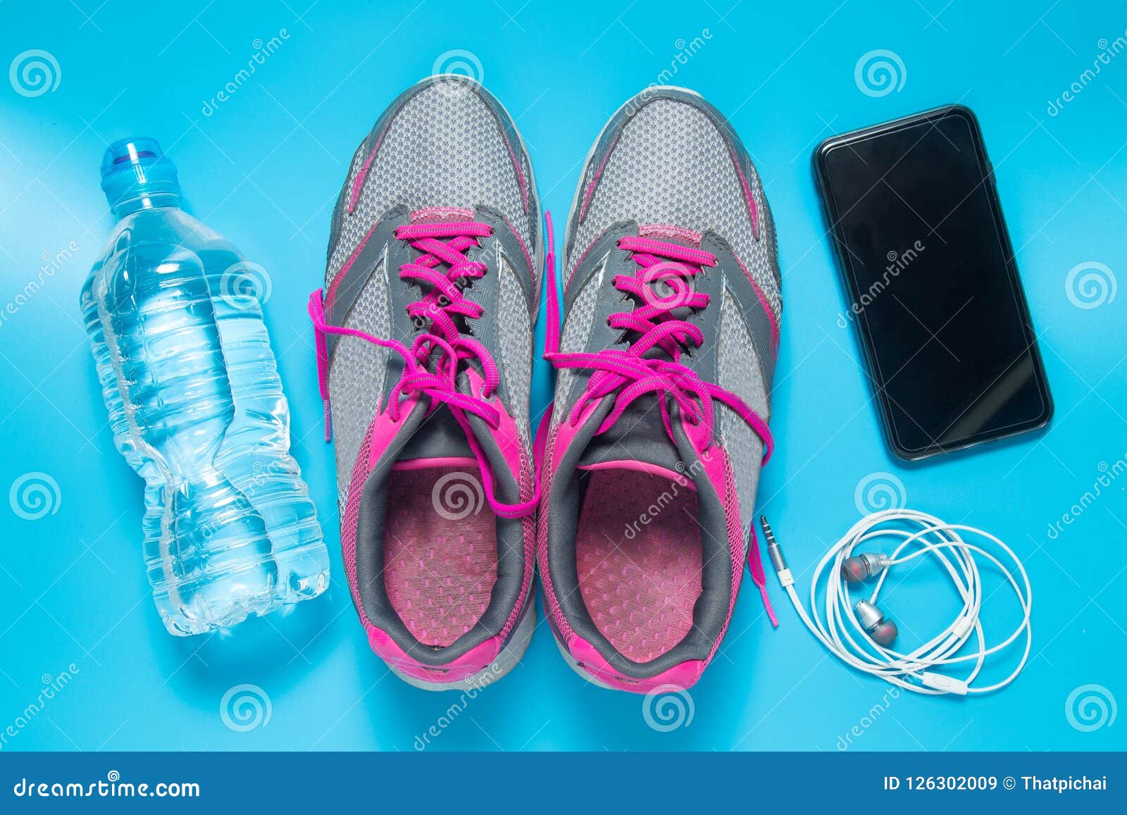 Sport Flat Lay Pink Shoes with Bottle of Water, Phone, Earphones on ...