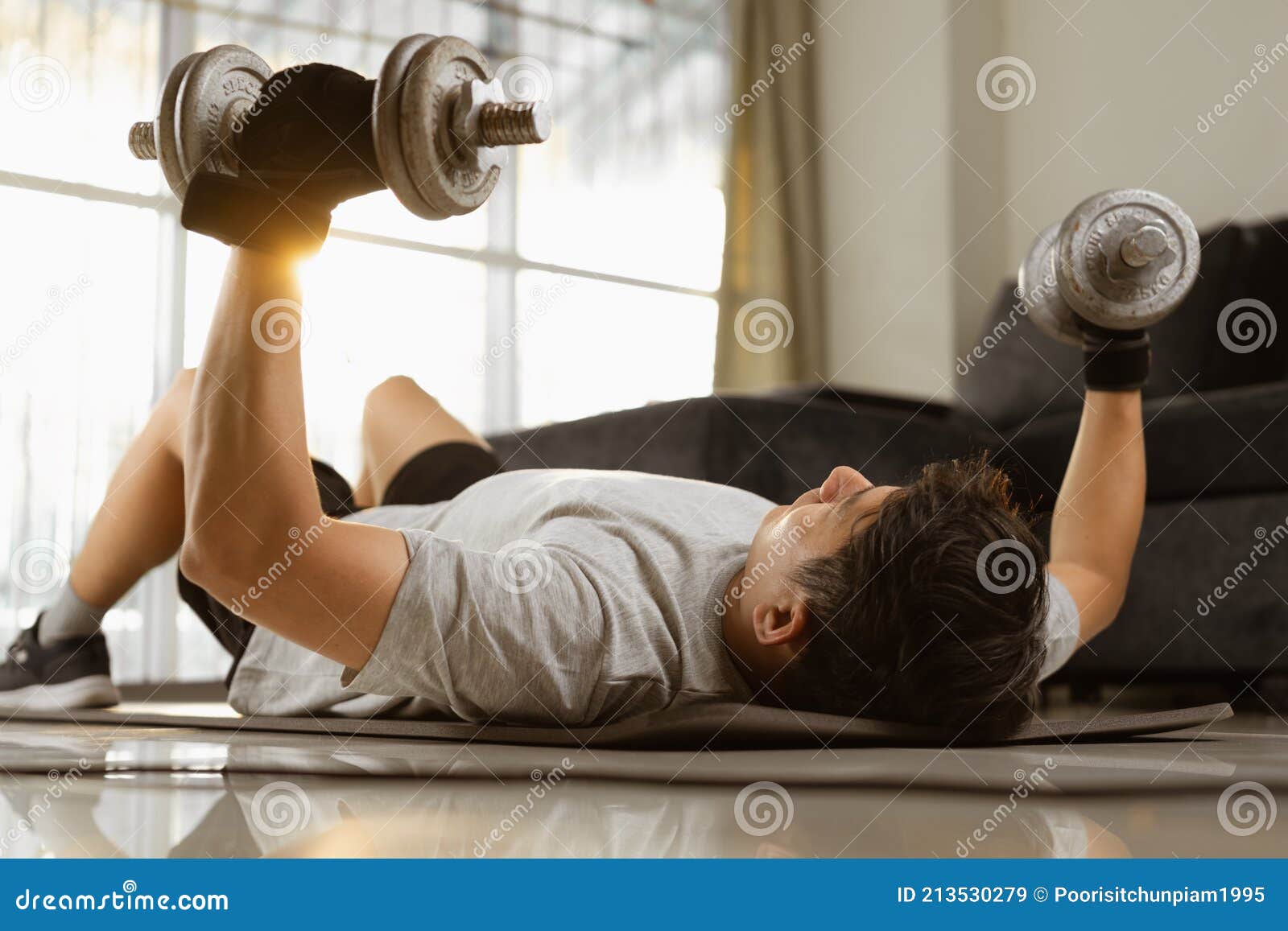 Sport Man Doing Dumbbell Bench Press for Chest Exercise Workout in