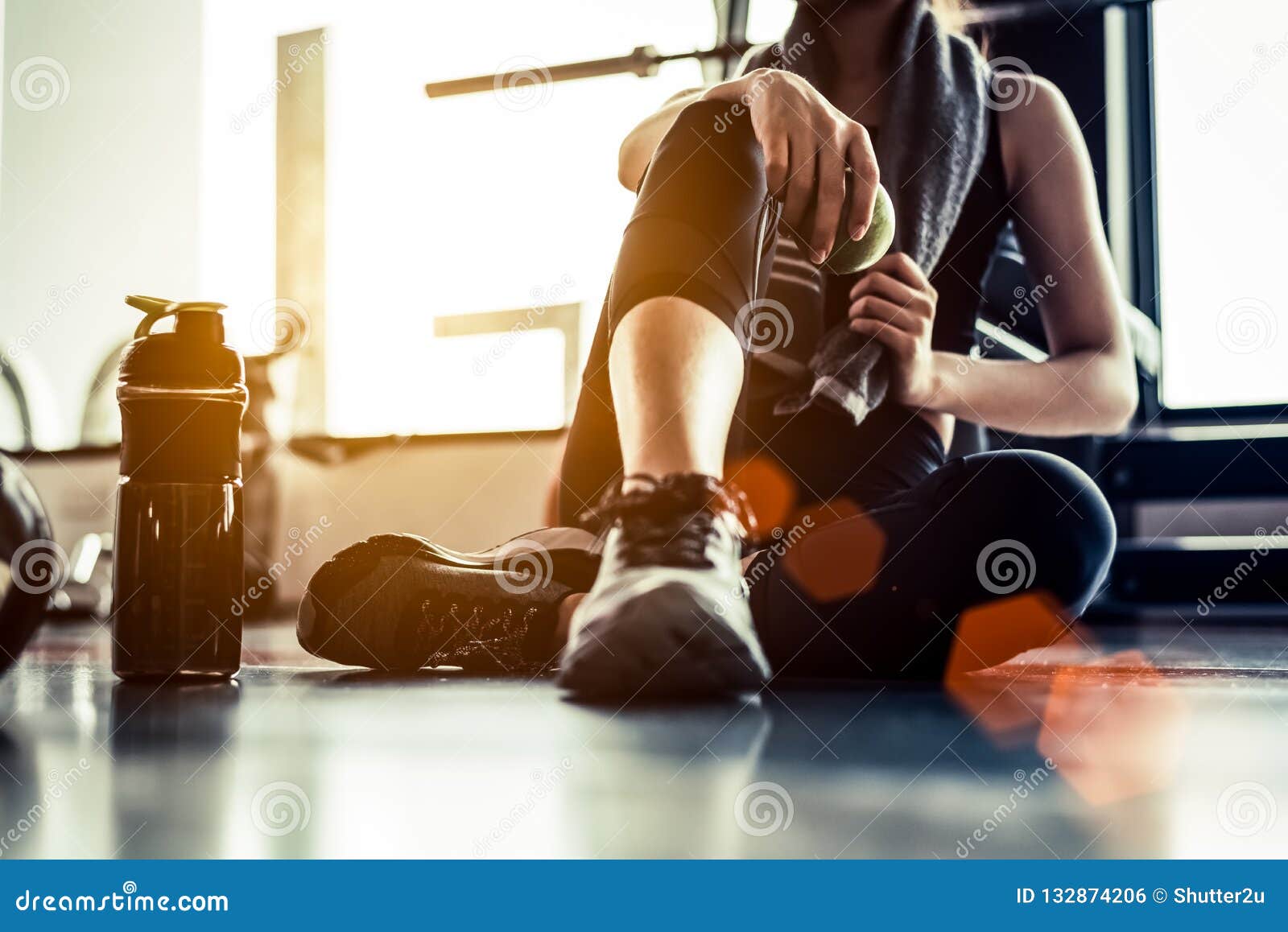 sport woman sitting and resting after workout or exercise in fit