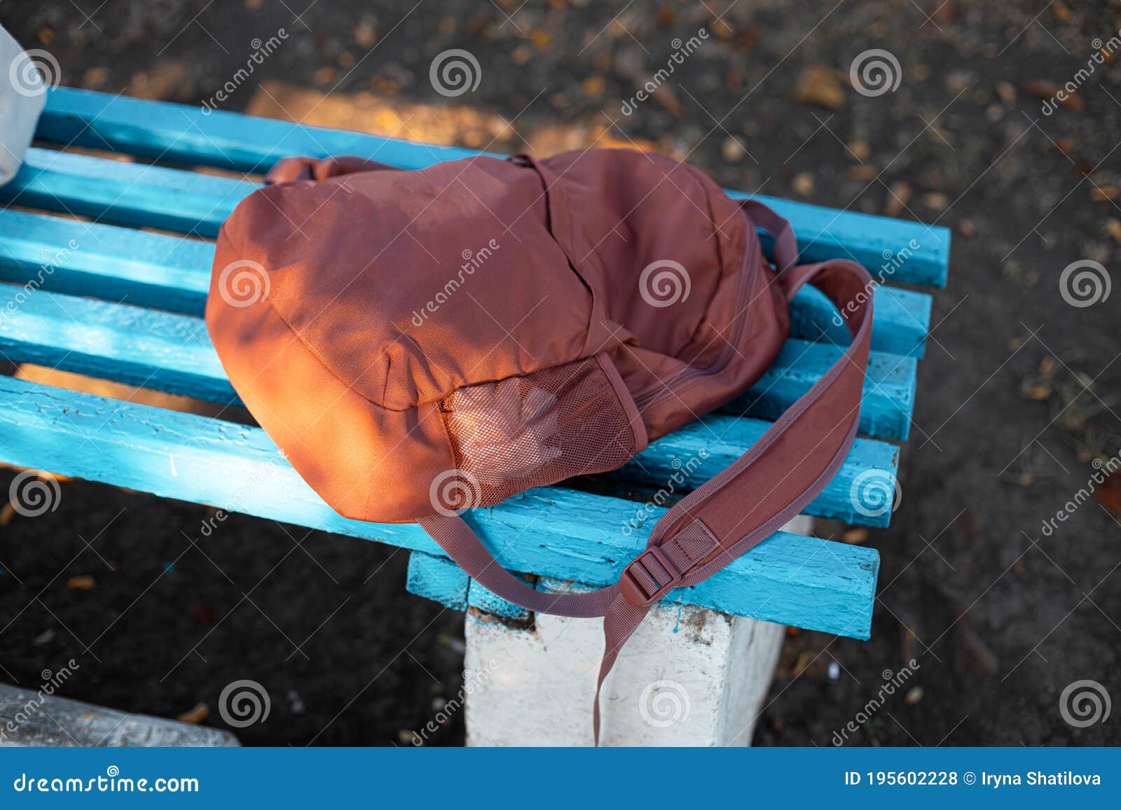 Sports Backpack with on a Bench Outdoors Stock Photo - Image of ...