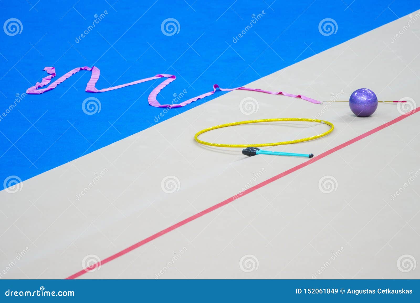 Sports Equipment for Rhythmic Gymnastics Lie on the Edge of the Carpet in  the Gym. Rhythmic Gymnastics Clubs, a Ball, a Hoop Stock Image - Image of  body, girl: 152061849
