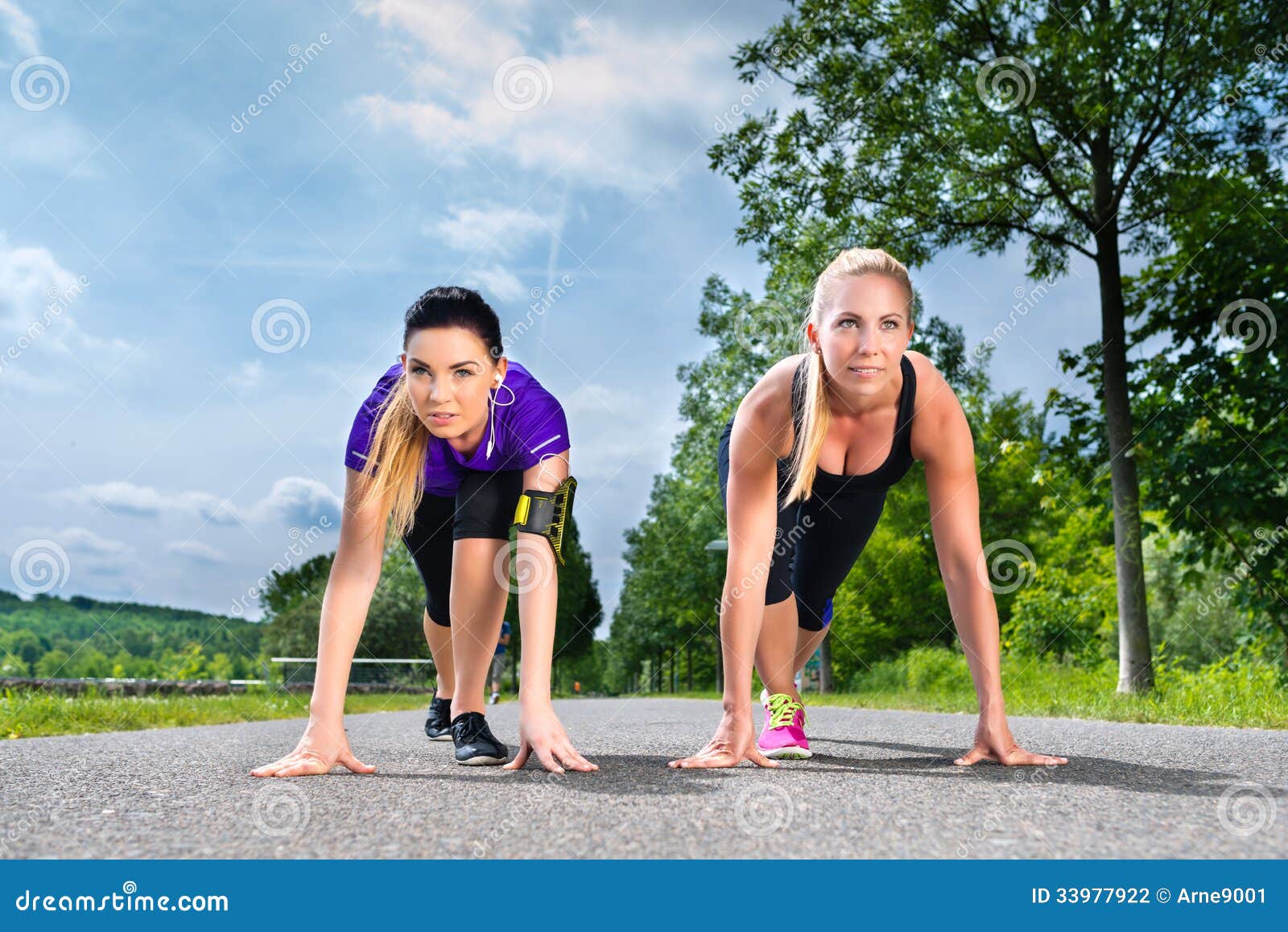 Sports Outdoor - Young Women Doing Fitness in Park Stock Photo