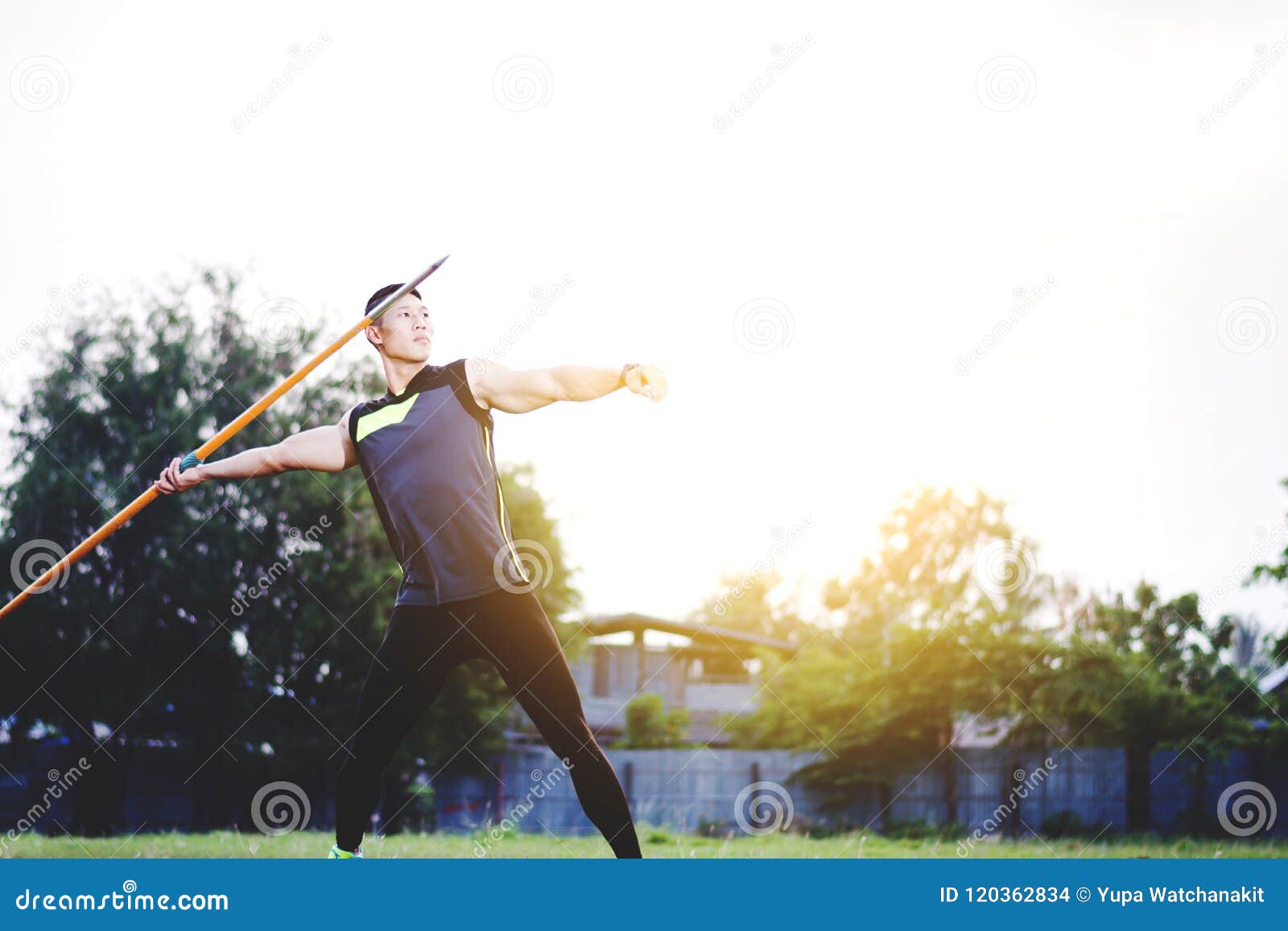 Man Warming Up and Practicing Javelin Throw in Yard Stock Photo Image