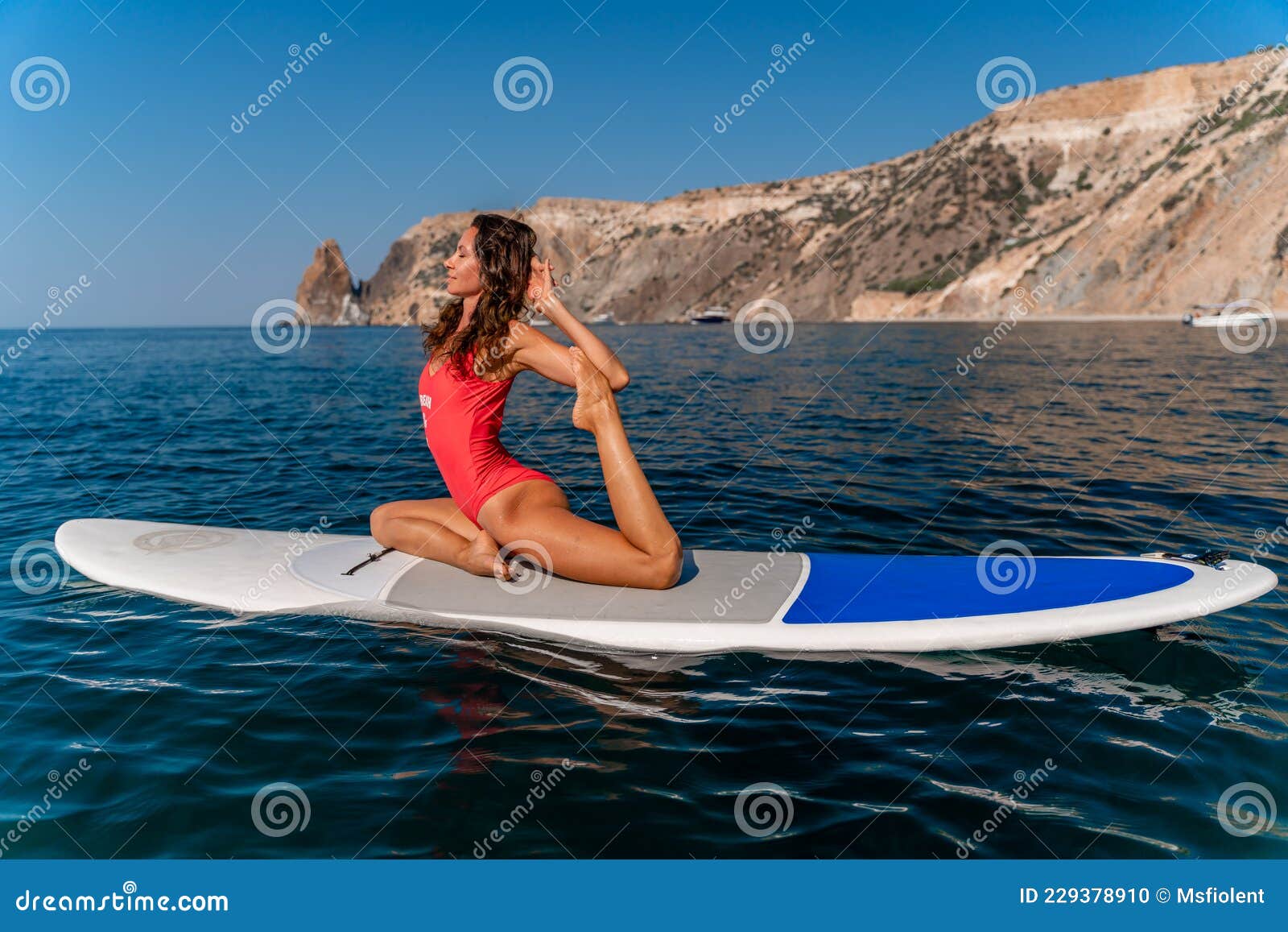 Sporty Girl on a Surfboard in the Sea on a Sunny Summer Day. in a