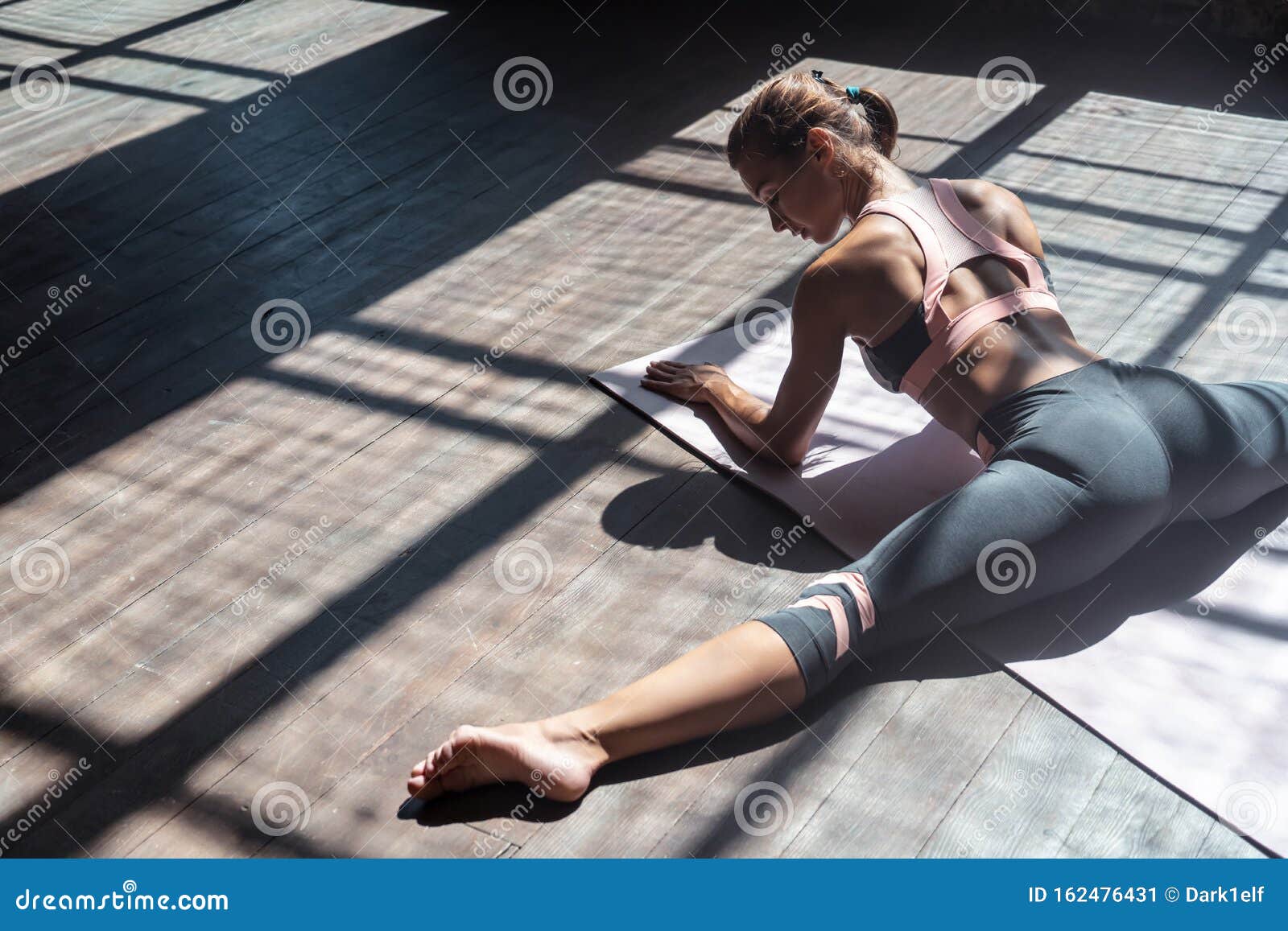 Sporty Young Woman Stretching Legs Split Sit On Mat In Gym Stock Image Image Of Flexibility
