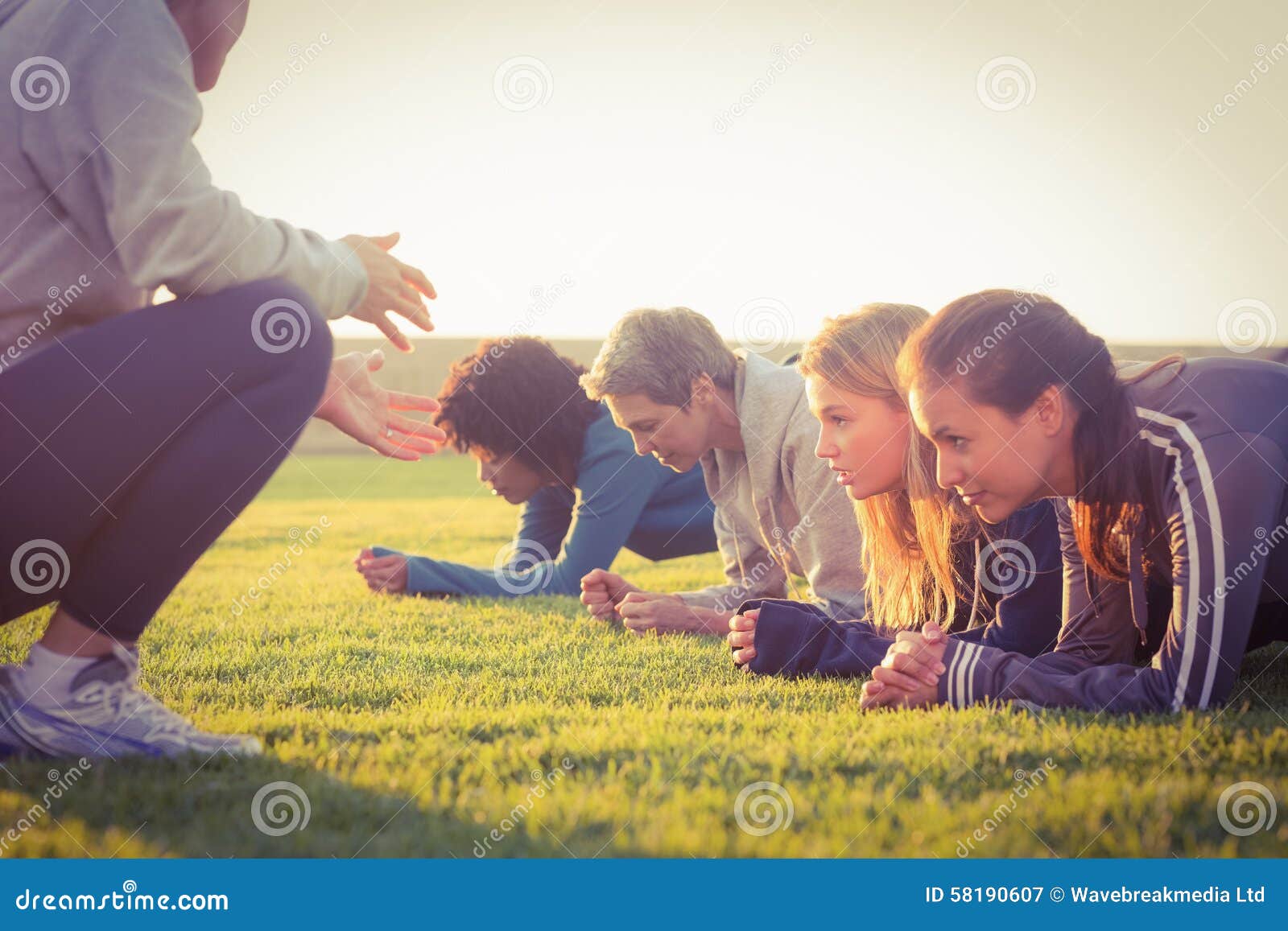 sporty women planking during fitness class