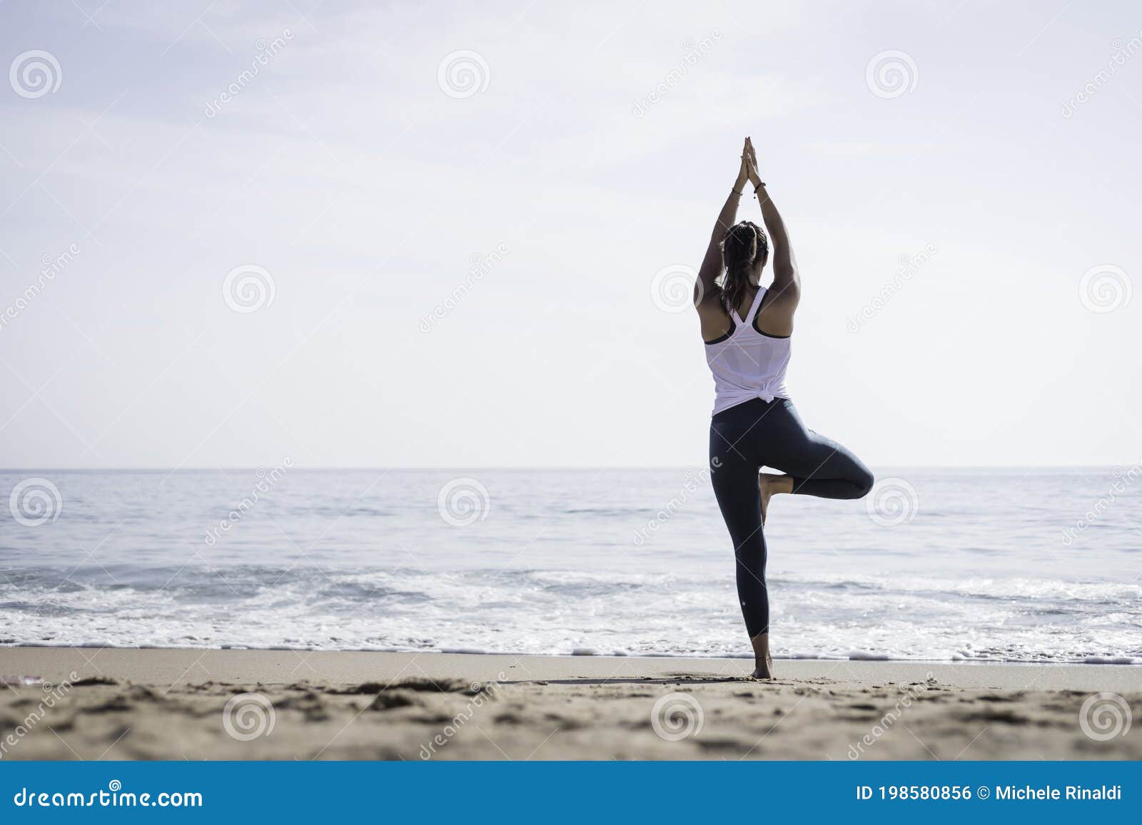 Sporty Young Woman Doing Yoga Exercises Using a Gym Mat Along the Beach in  Lisbon, Portugal. Playful Woman Working As Freelance Stock Photo - Image of  entrepreneur, lesson: 198580856