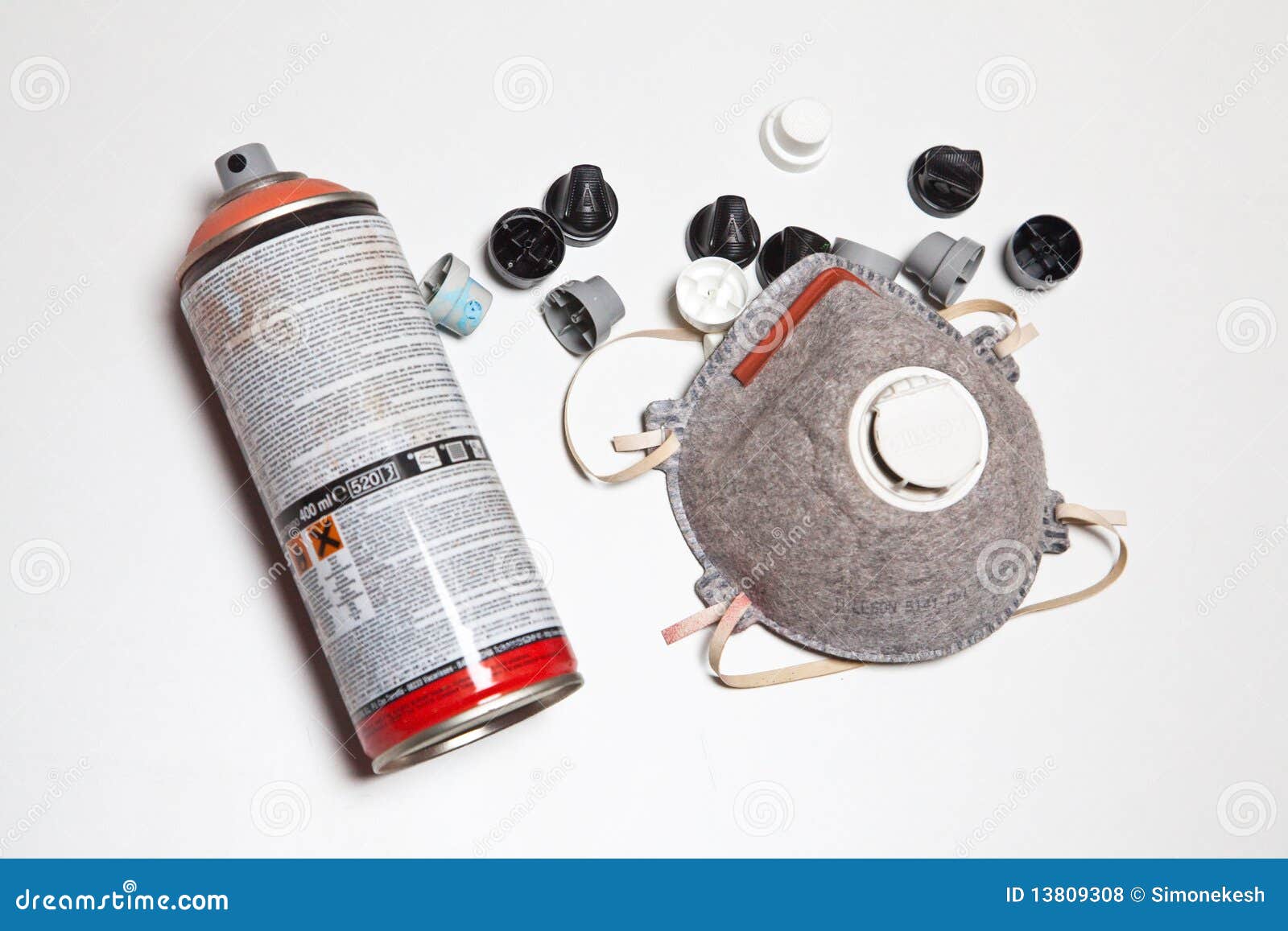Spray cans and mask stock photo. Image of cans, orange 13809308