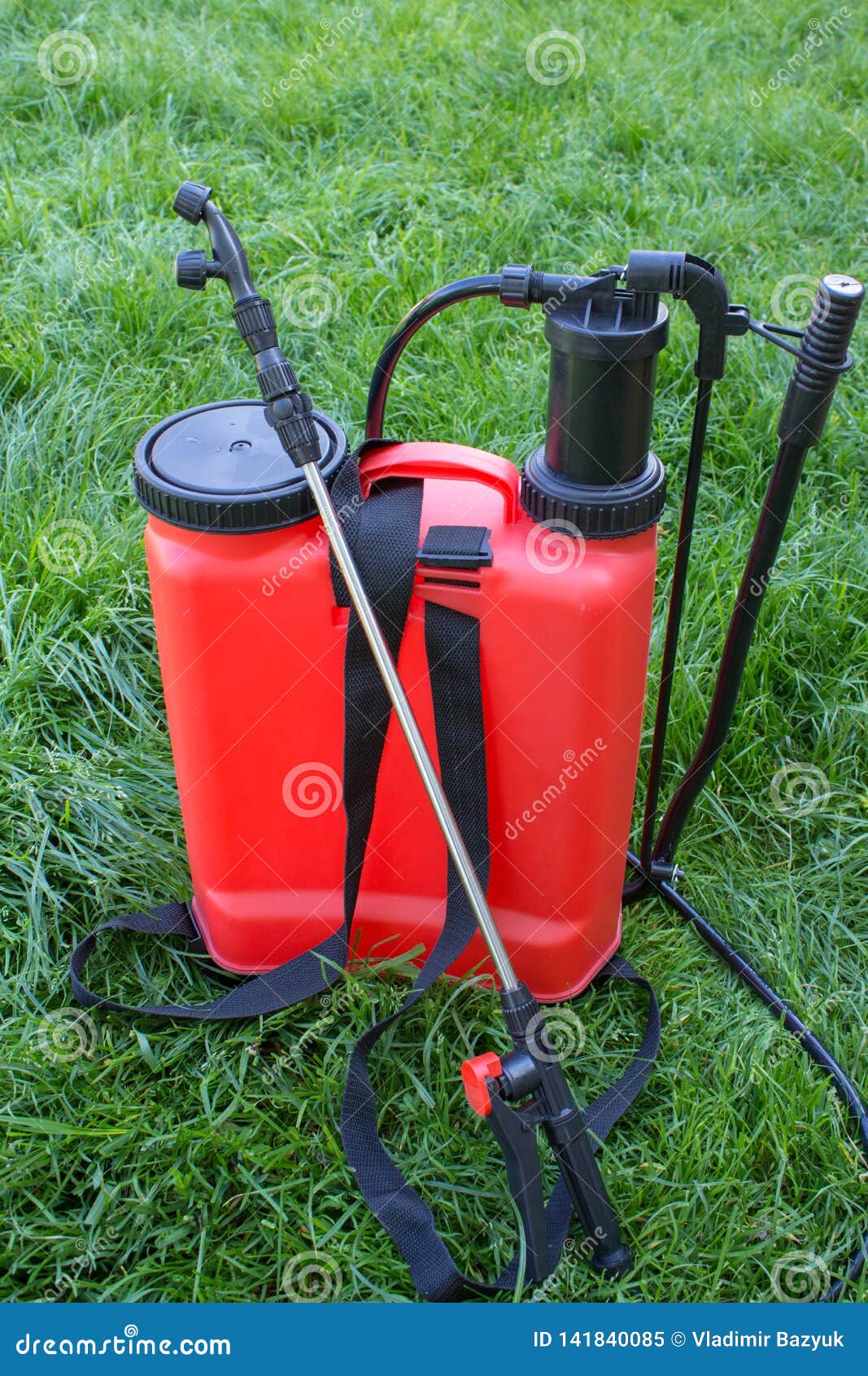 Grass There Is A Red Garden Sprayer 