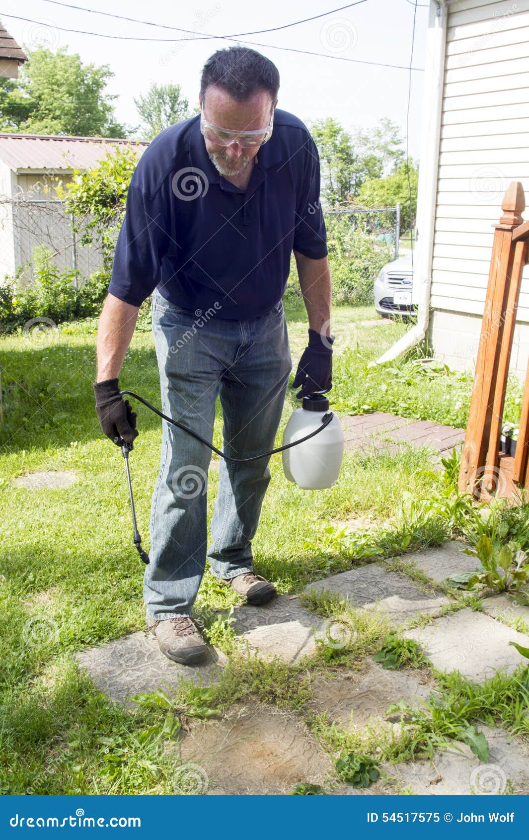 Spraying Weed Killer on a Patio Stock Image Image of sprayer