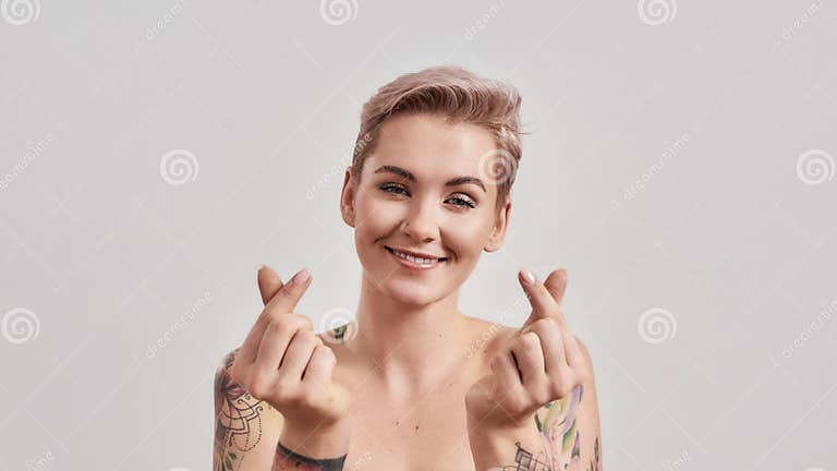 Spread Love Portrait Of Cheerful Half Naked Tattooed Woman With Pierced Nose And Short Hair