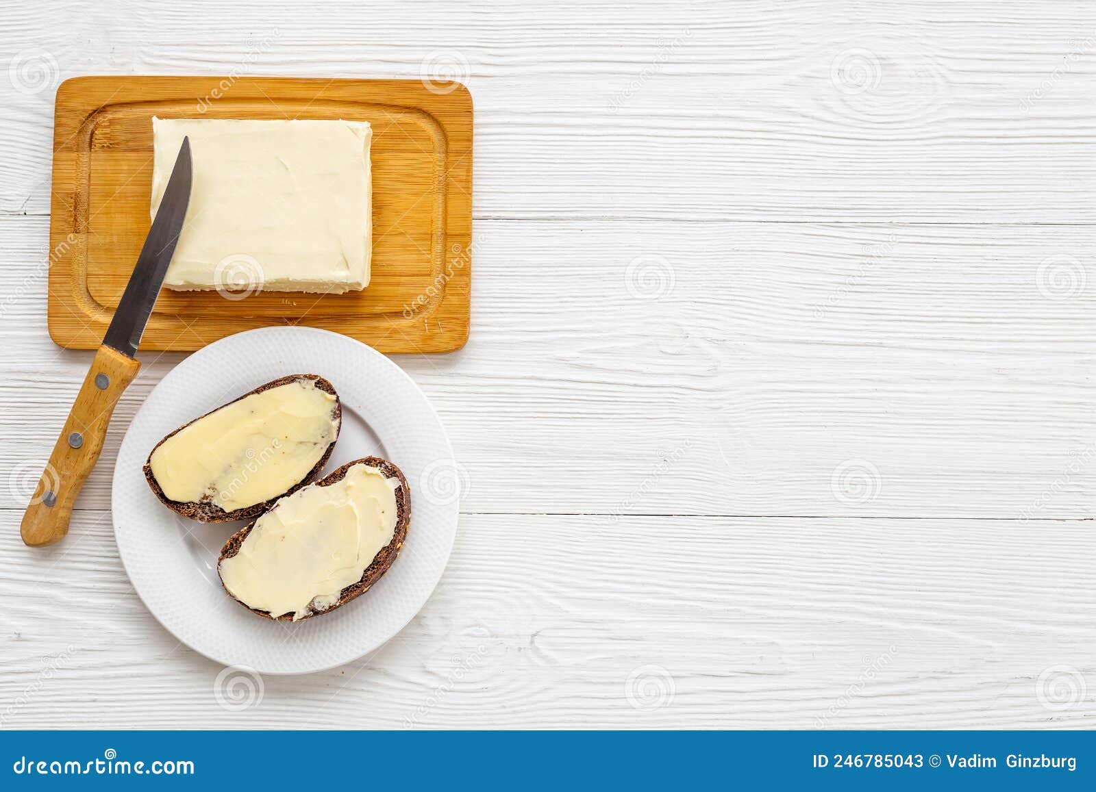 Spreading Butter with Knife on Toast Bread. Top View Stock Image