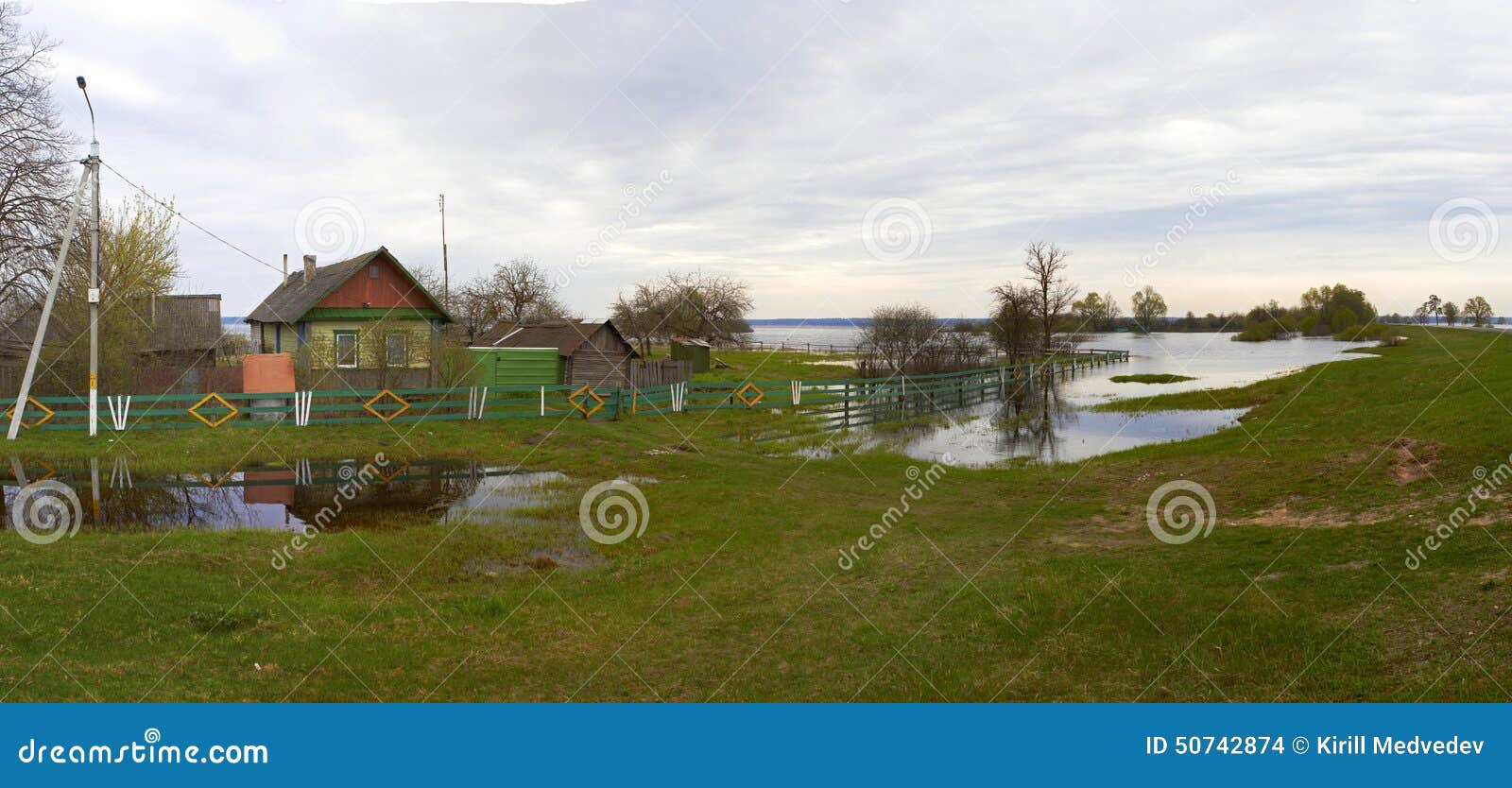 spring panorama with the river in flood cloudy day