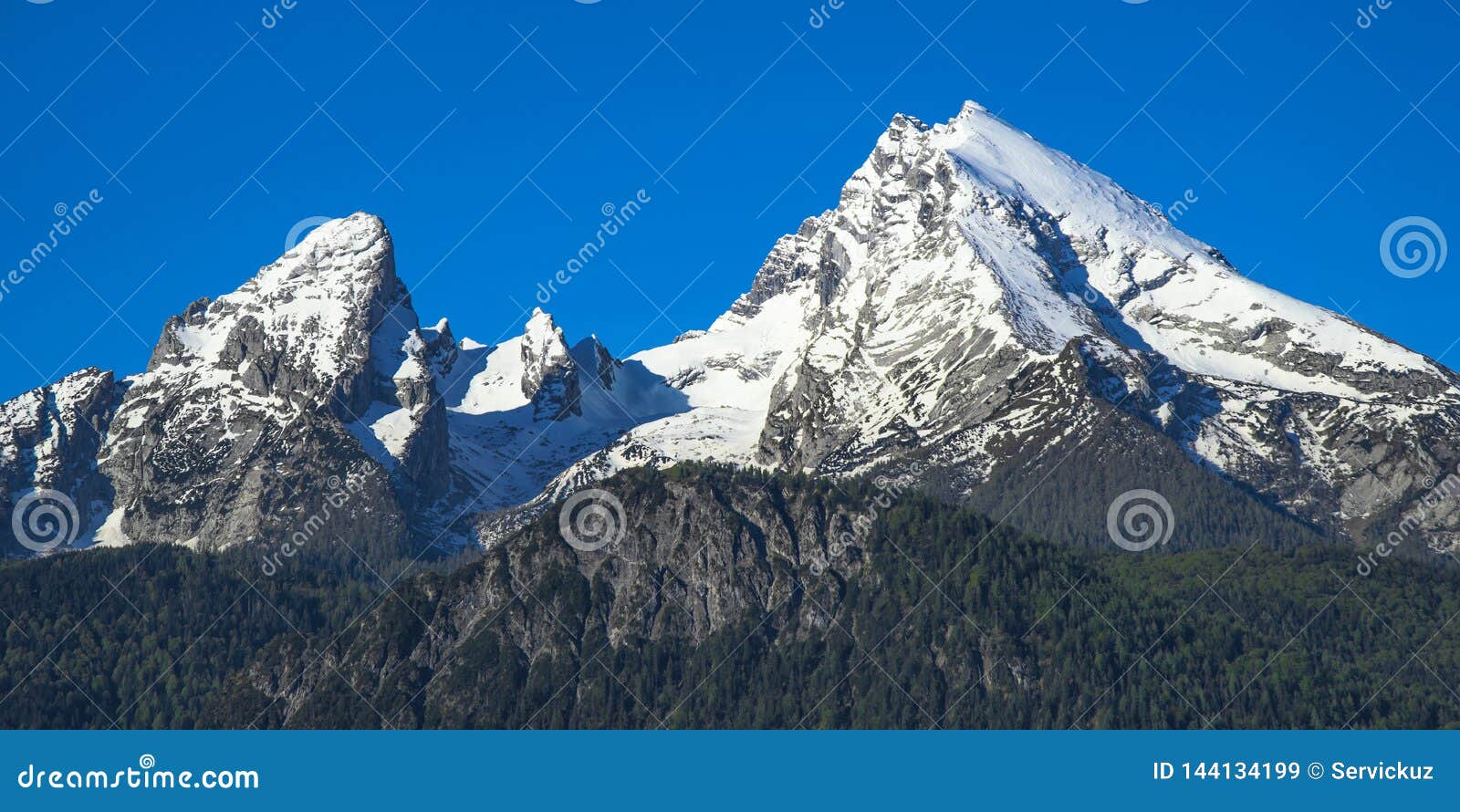 spring snow-capped peaks of watzmann mountain in national park berchtesgaden