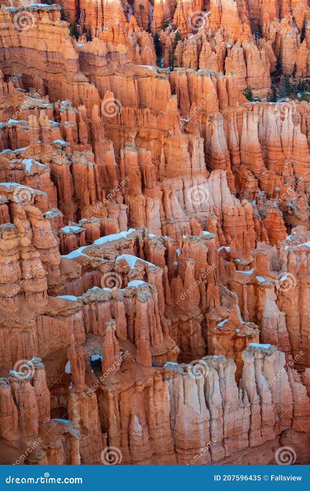 spring view of bryce amphitheater in snow from sunrise point at sunset