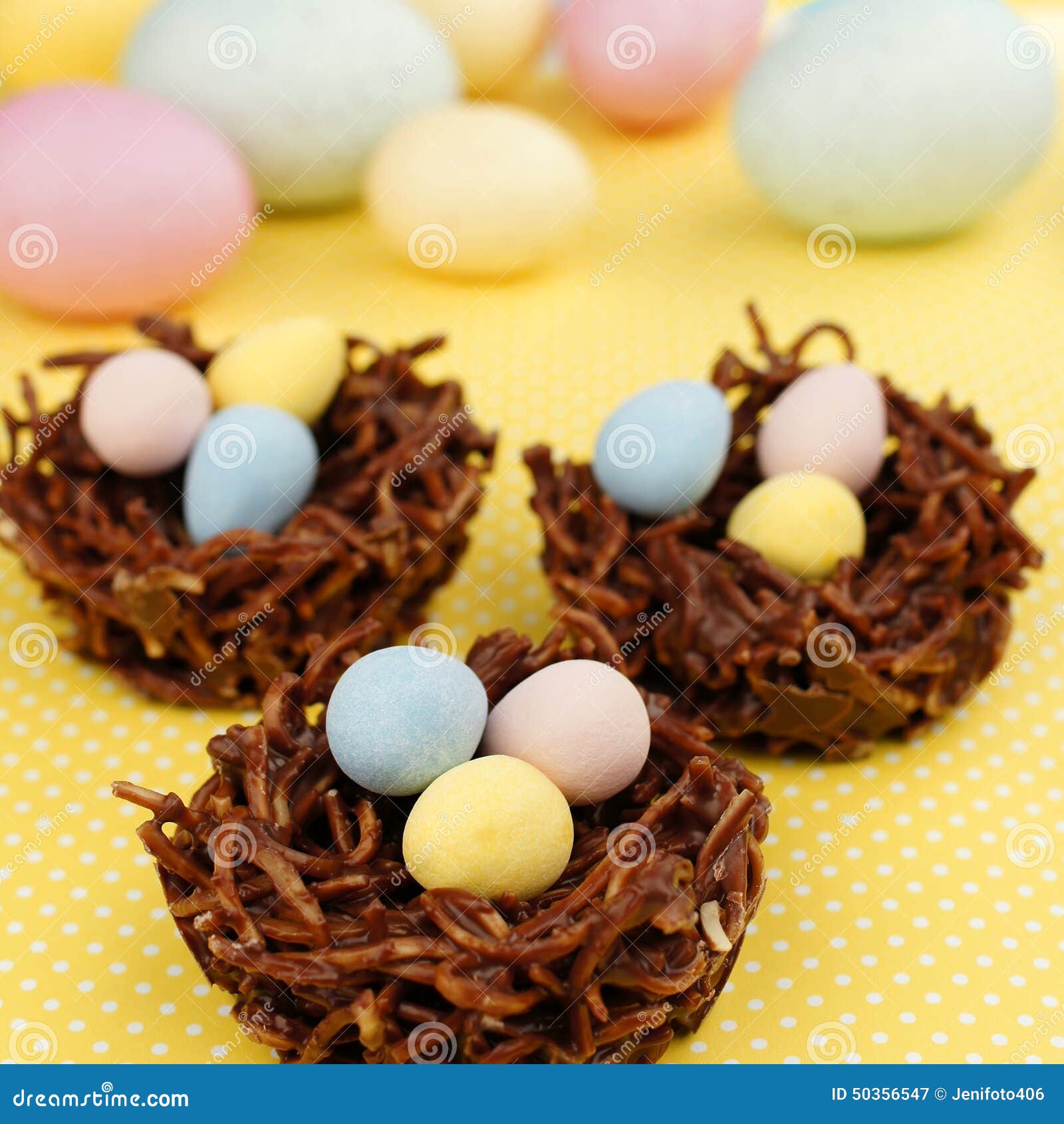 springtime chocolate nests filled with easter eggs on yellow