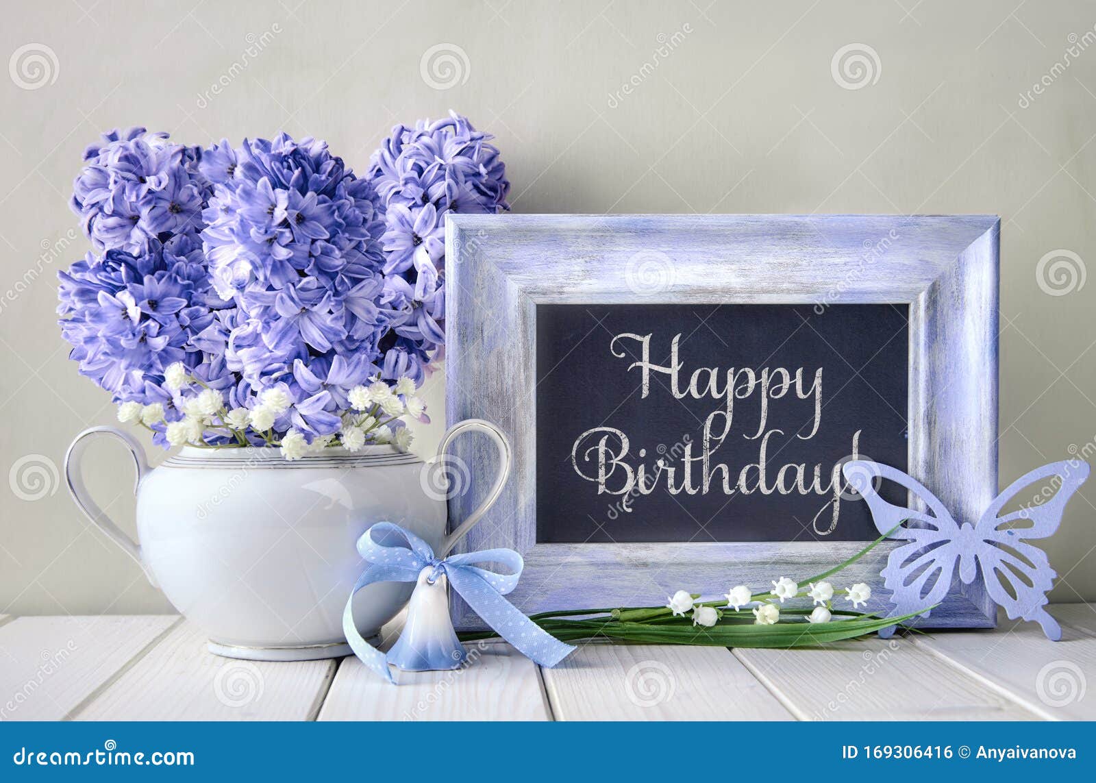 Blue Decorations and Hyacinth Flowers on White Table, Blackboard ...