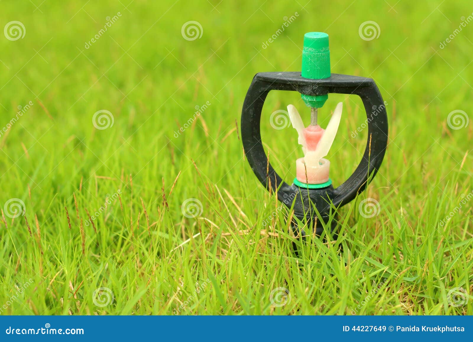 Sprinkler is Stuck in in the Grass. Stock Image Image of field, lawn 44227649