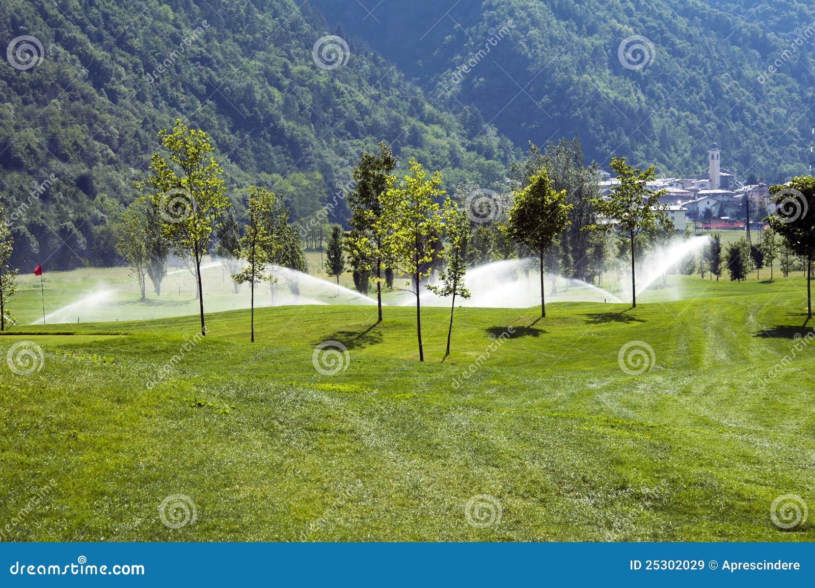 Sprinklers on golf course stock image. Image of recreation 25302029