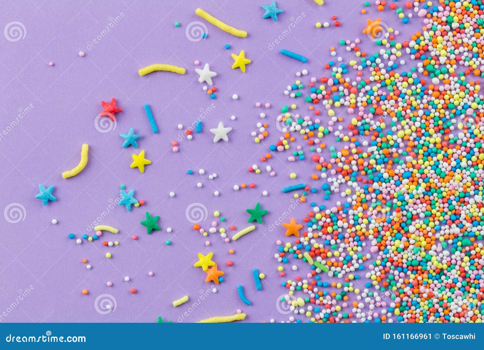 Sprinkles on Purple Background Cake Topping Sprinkles Sprayed on Lilac Background Stock Image