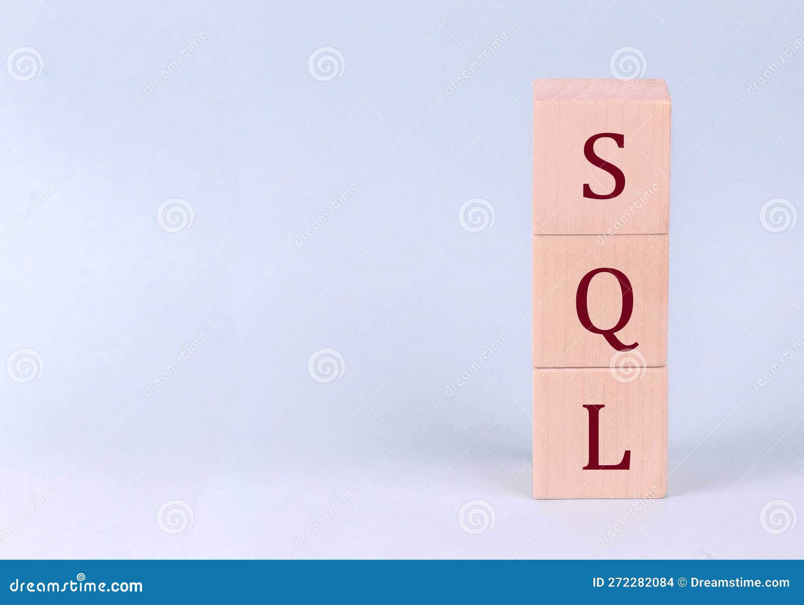 SQL - Structured Query Language on Wooden Cubes on a Blue Background ...