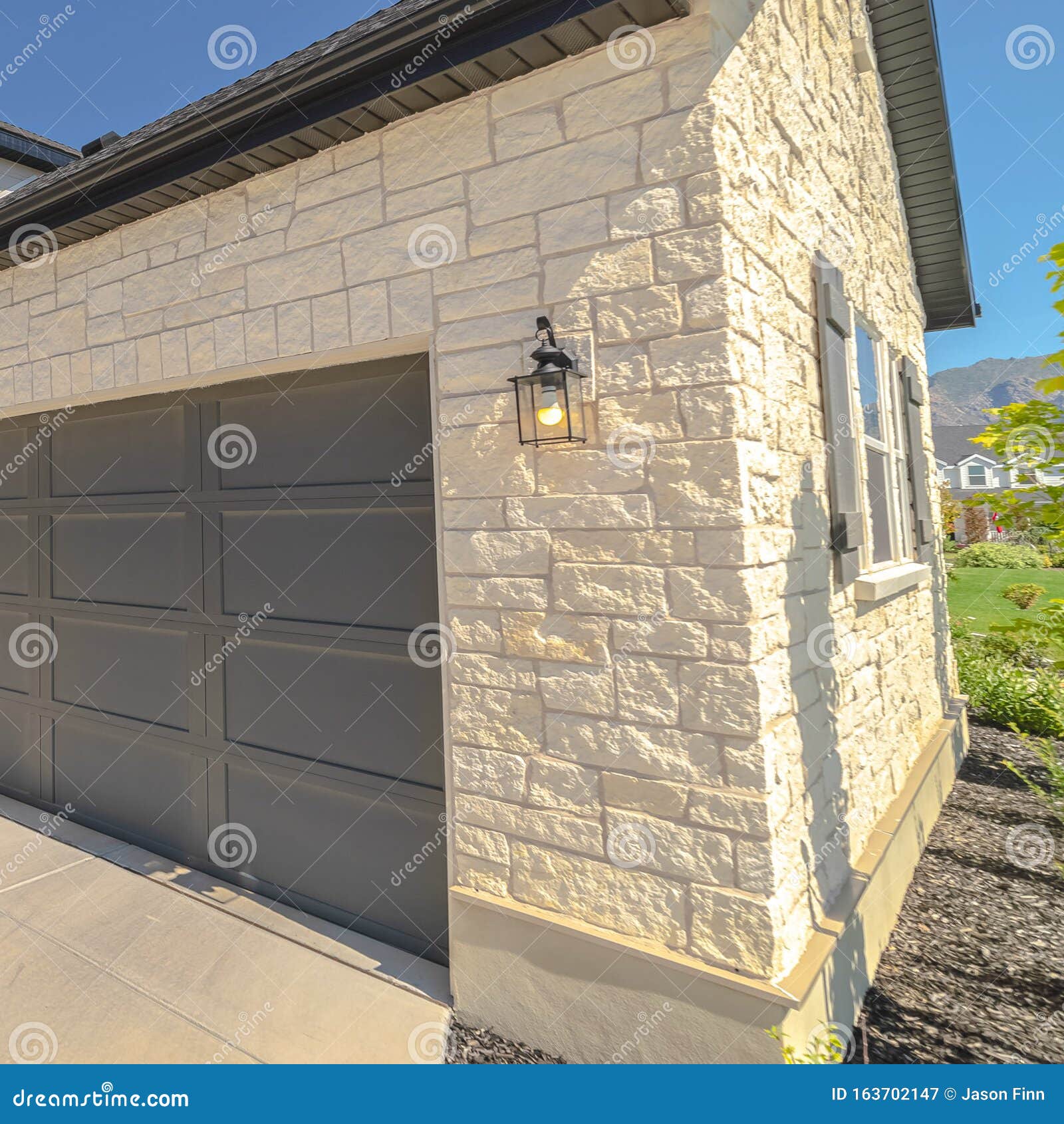 Square Frame Double Garage Doors at Right Angles Exterior Stock Image