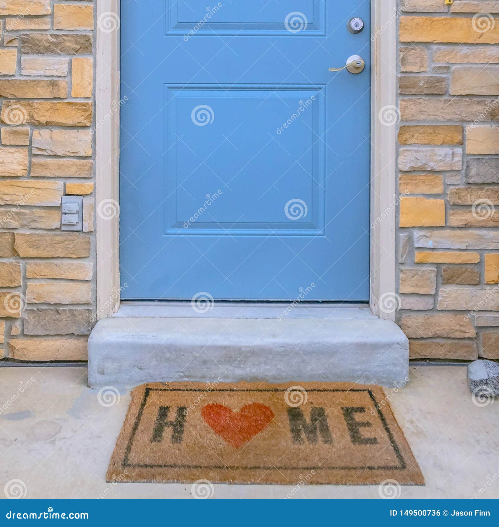 Square Frame Entryway Of A Home With Stairs Leading To The