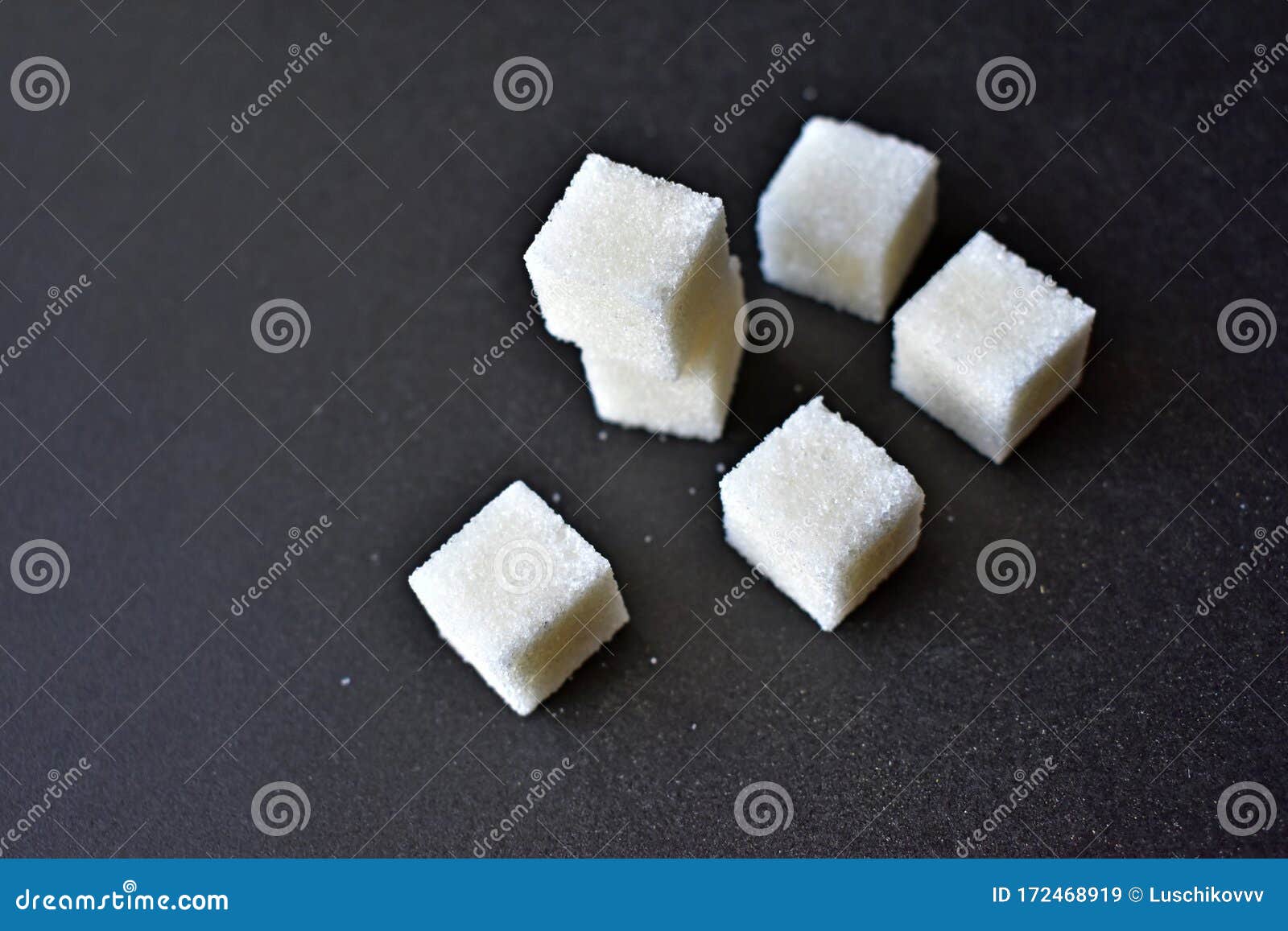 Square Pieces of Refined Sugar on a Black Background Stock Image ...