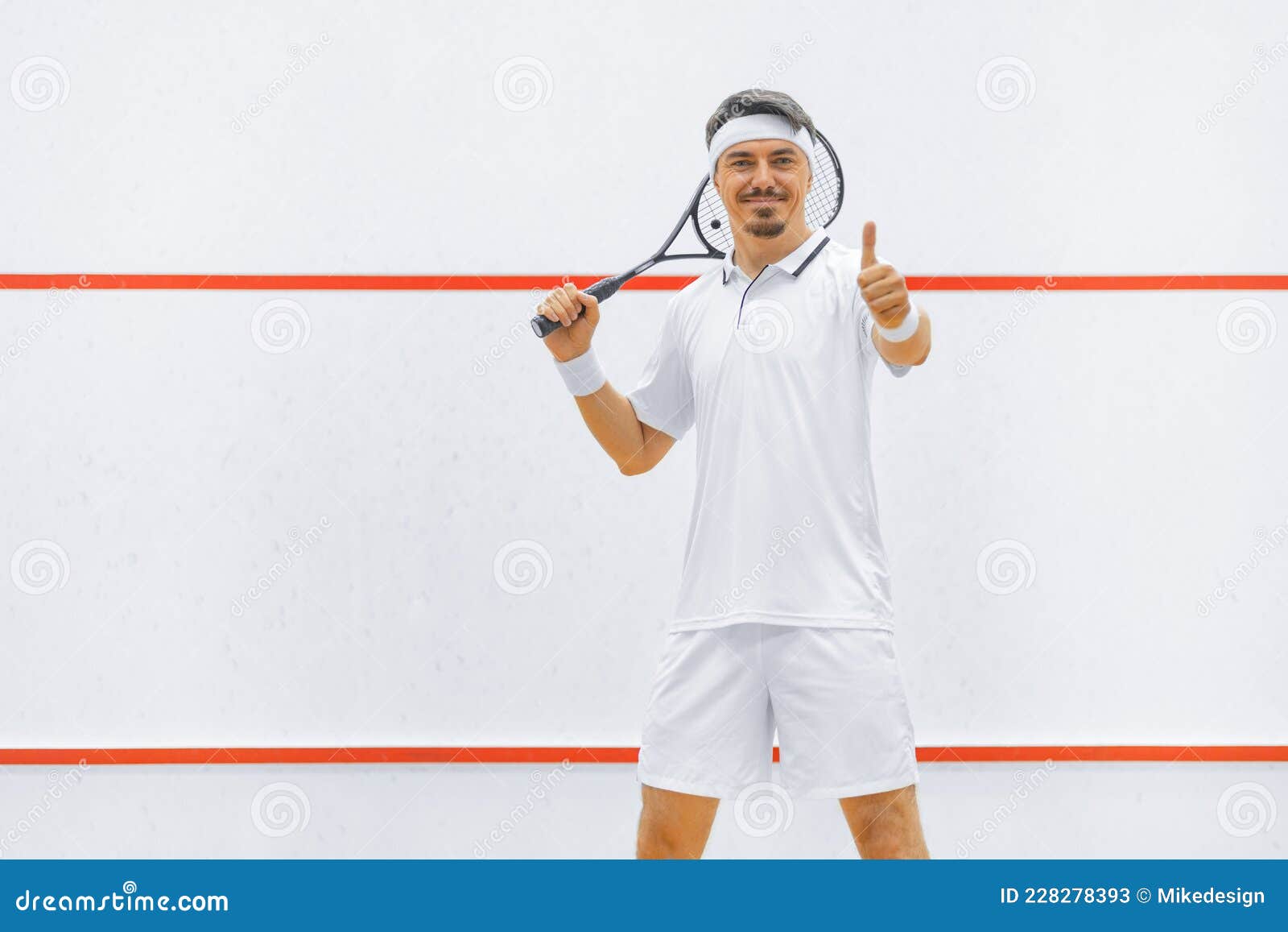 A Squash Player on a Squash Court with the Racket. White Sportswear