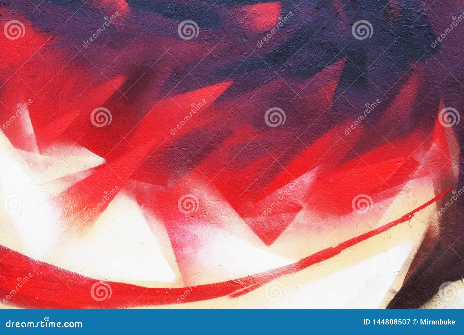 sred flame abstract street art. background image of a fragment of a colored graffiti painting in red tones