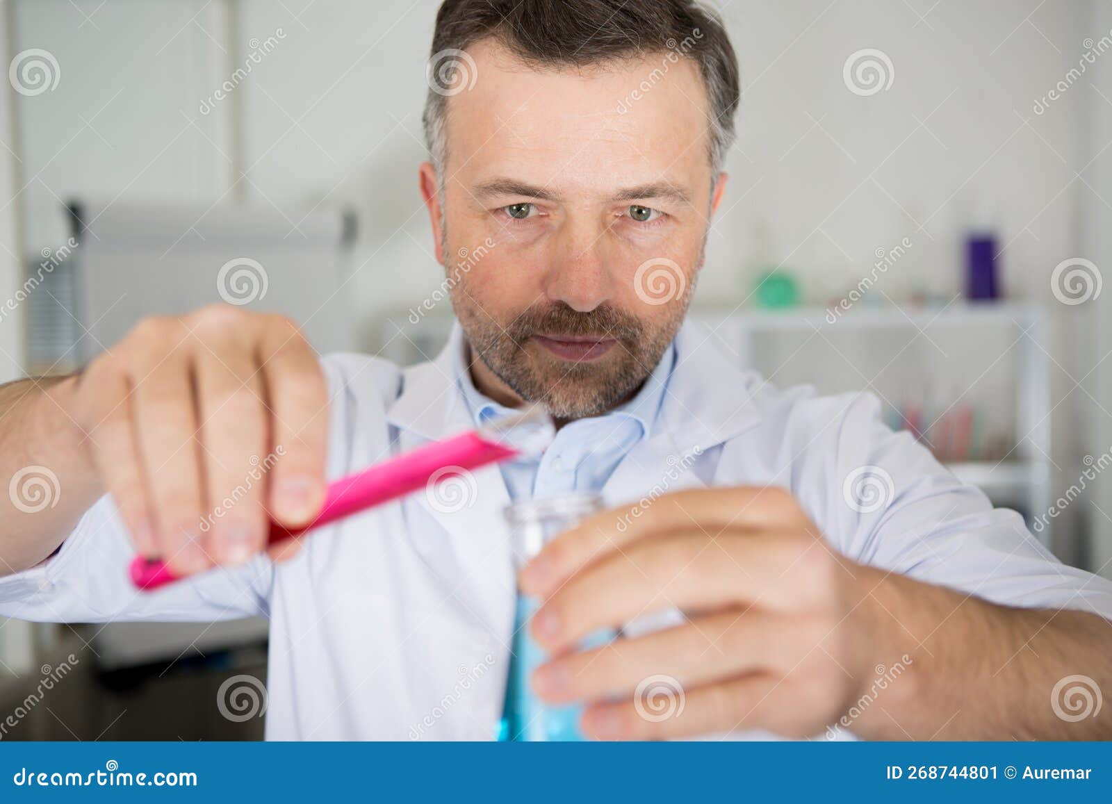 Sscientist Mixes To Liquids in Lab Stock Image Image of liquids