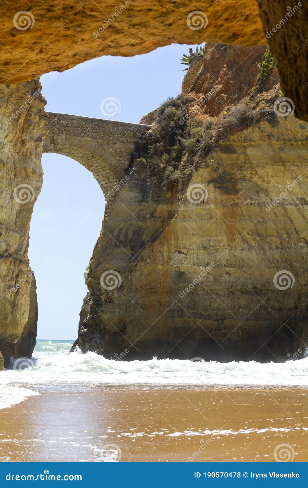 sstone footbridge at estudiantes beach in lagos, portugal