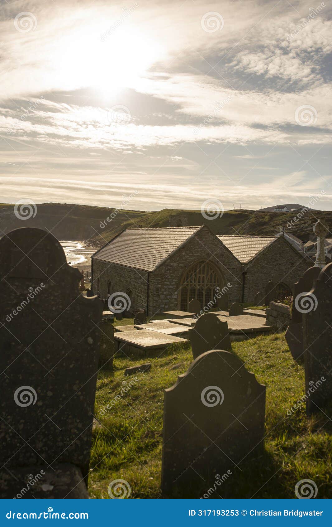 st. hywyn's church, aberdaron, wales in evening sunlight. an important place of pilgrimage